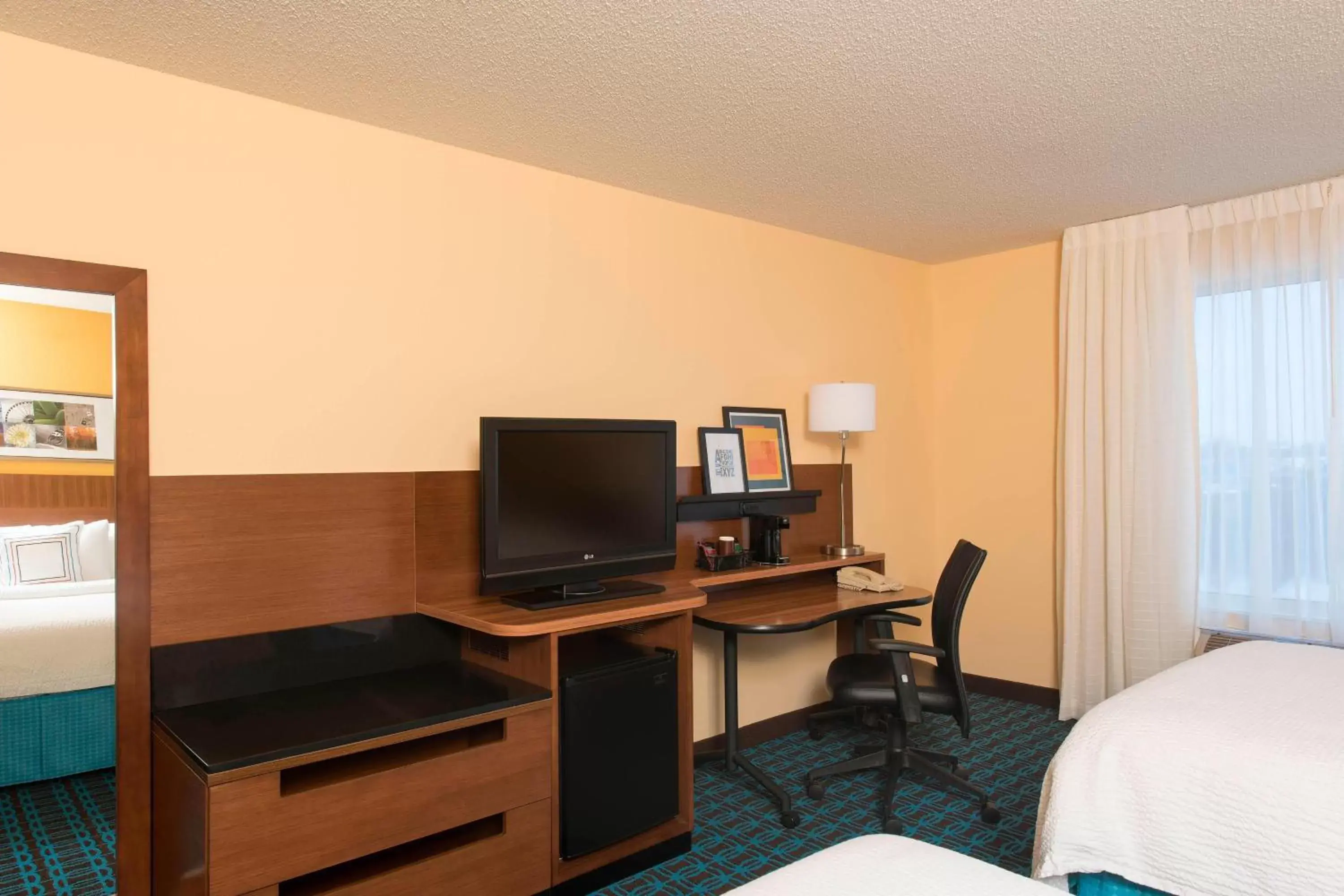 Photo of the whole room, TV/Entertainment Center in Fairfield Inn and Suites by Marriott Chicago St. Charles