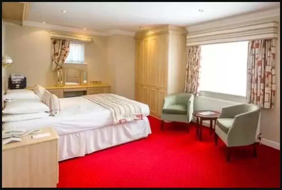 Bedroom in Consort Hotel