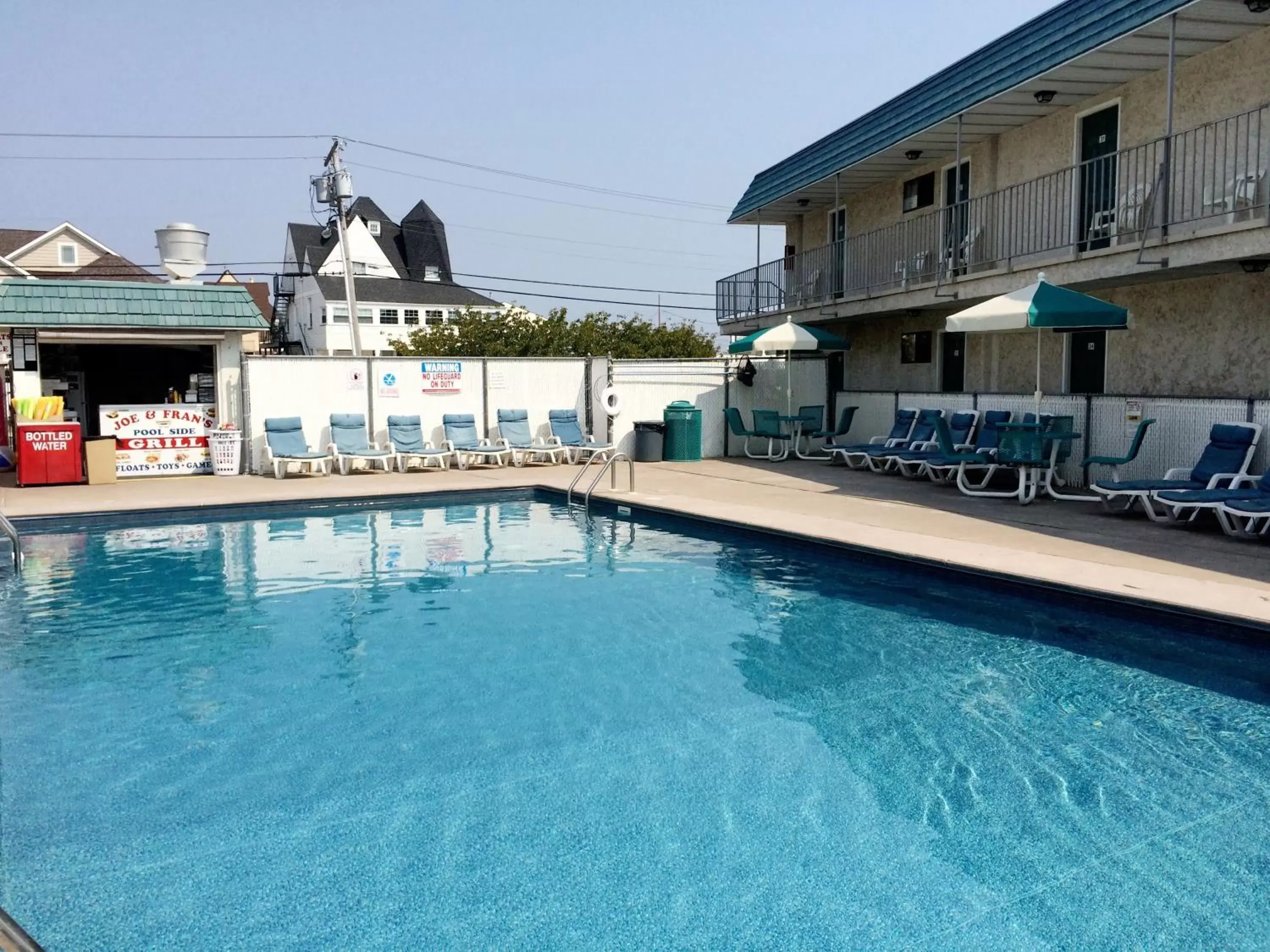 Swimming pool, Property Building in Sand Pebble Motor Lodge