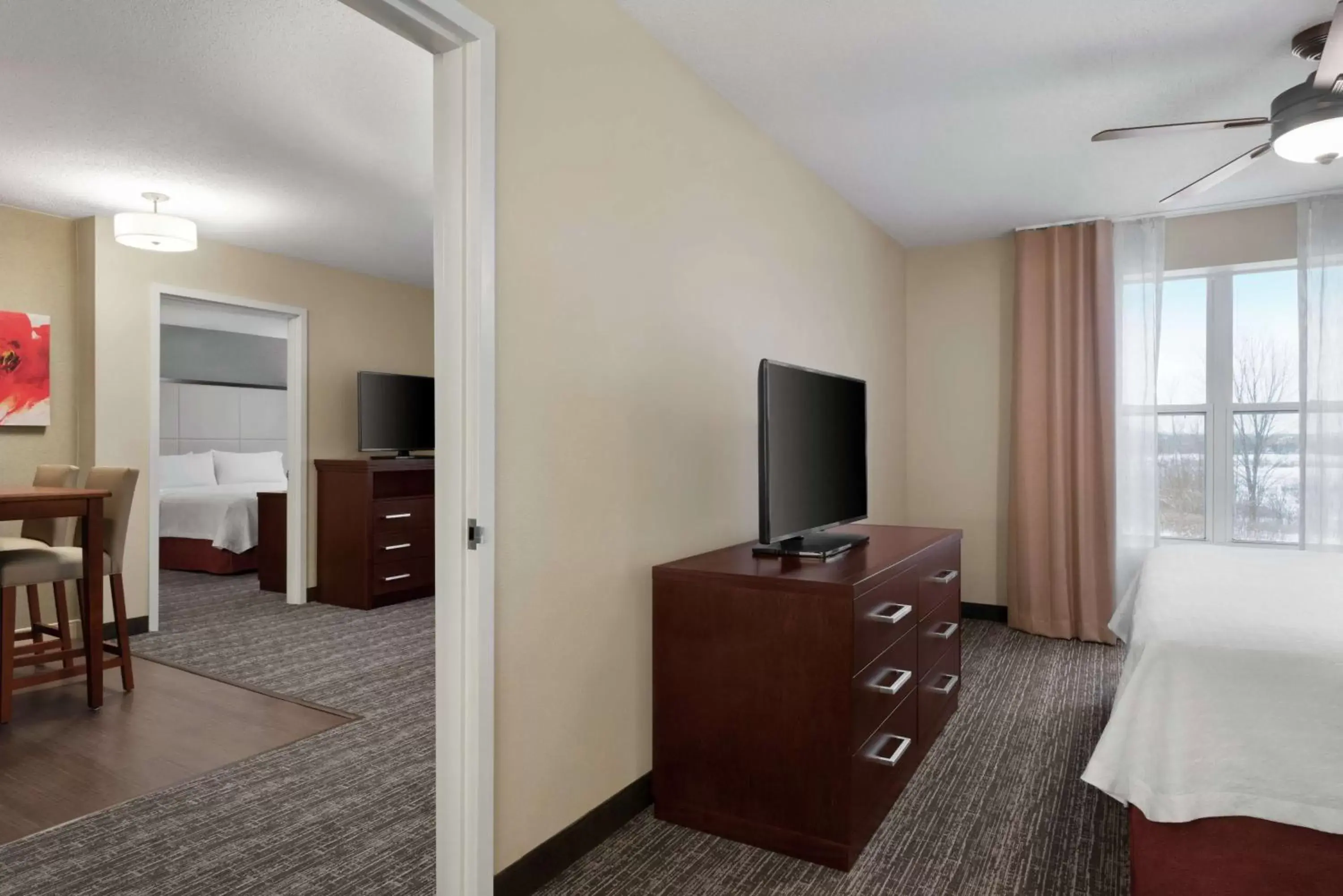 Bedroom, TV/Entertainment Center in Homewood Suites Rochester-Henrietta