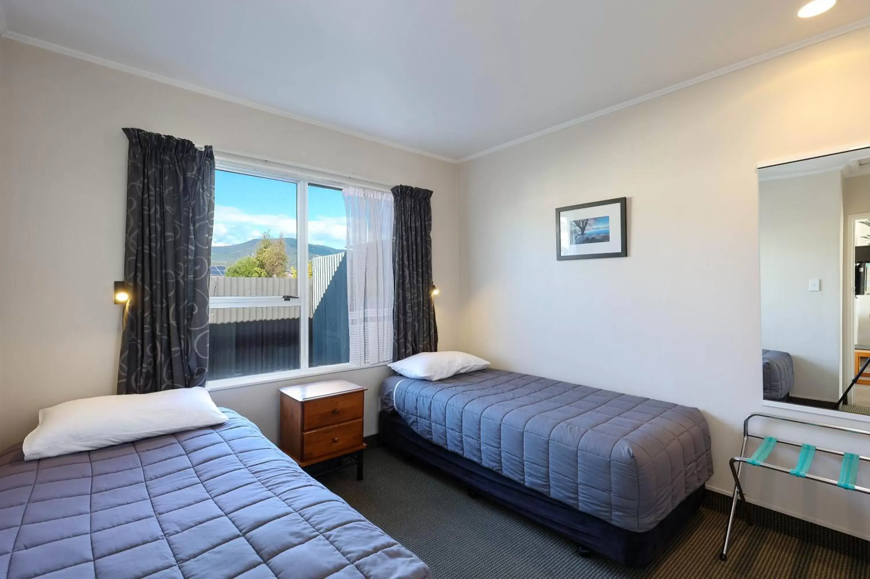 Bedroom, Bed in ASURE Fountain Resort Motel