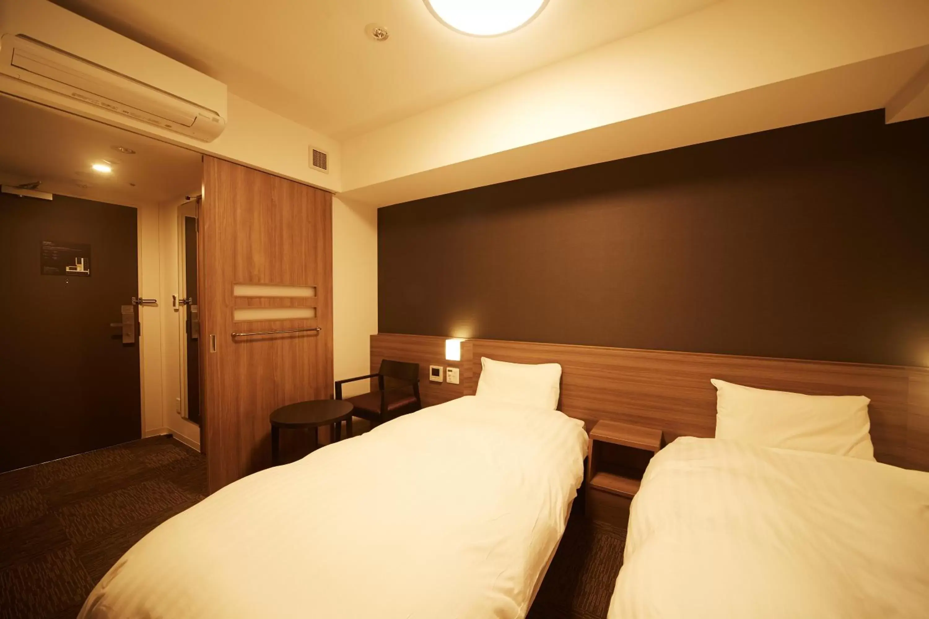 Bed in Dormy Inn Premium Nagoya Sakae