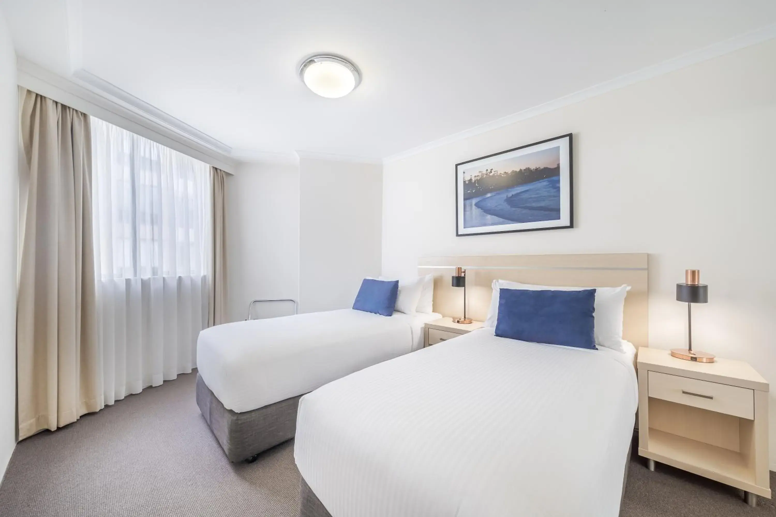 Bed in Oaks Sydney Castlereagh Suites