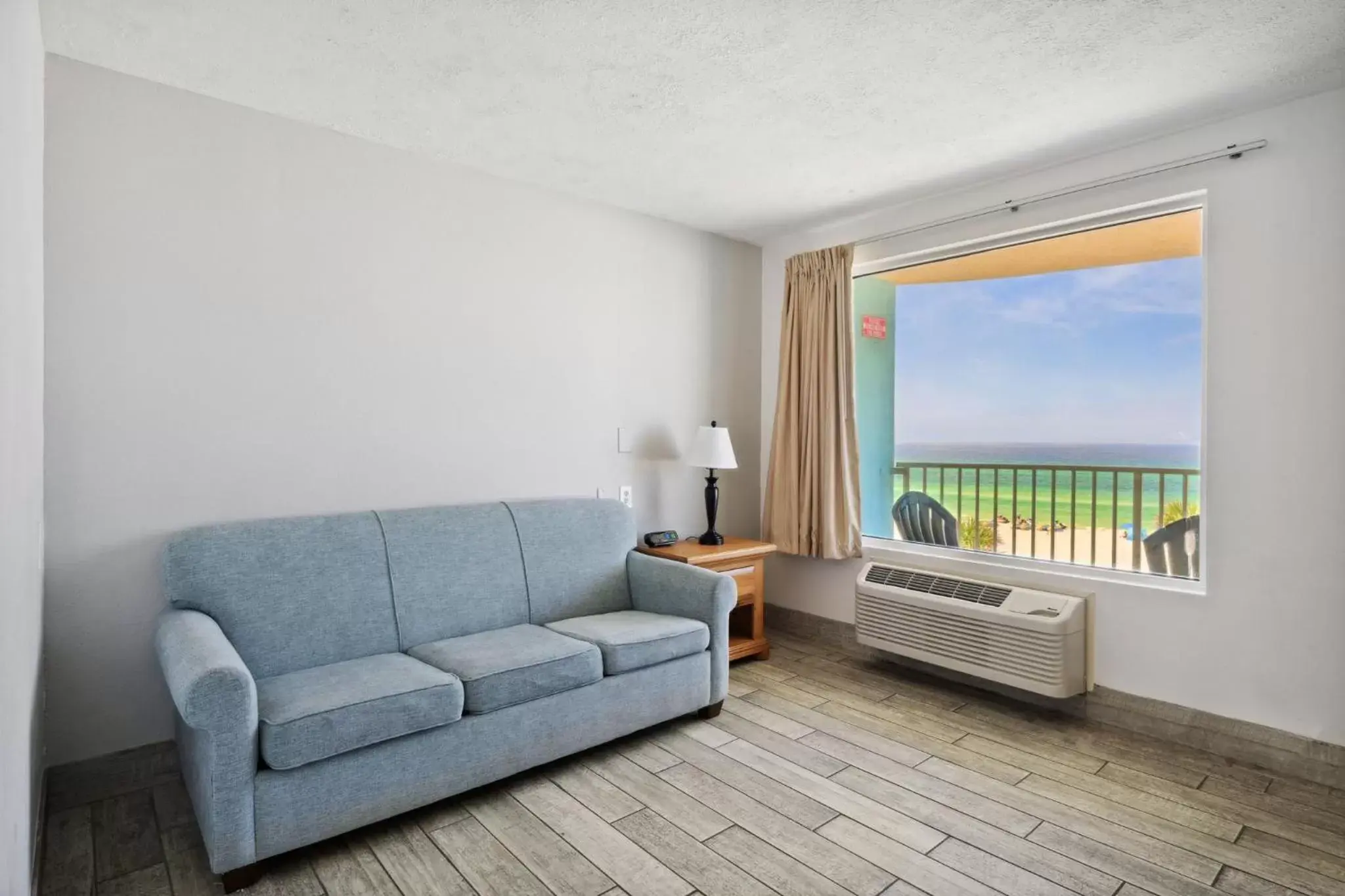 Living room, Seating Area in Holiday Terrace Beachfront Hotel, a By The Sea Resort