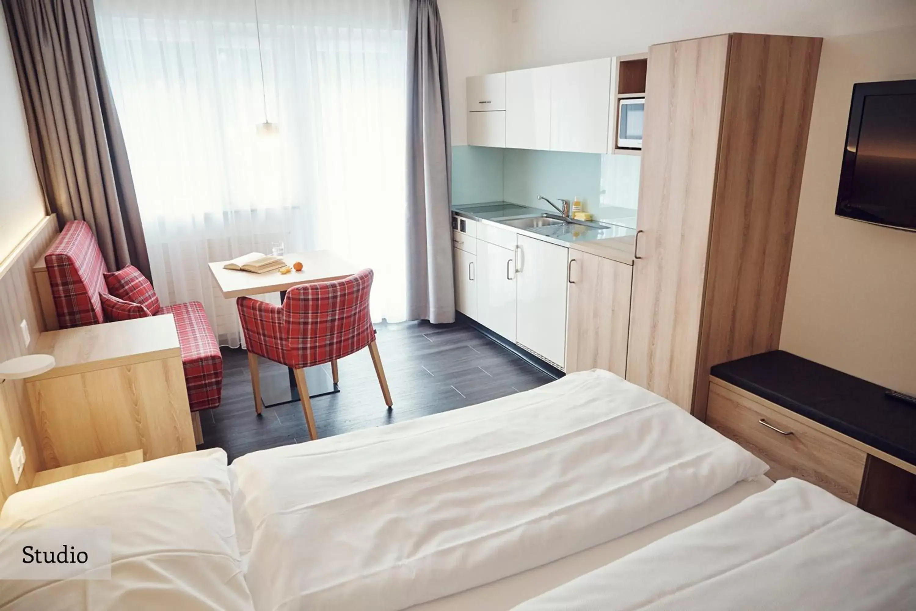 Kitchen or kitchenette, Bed in Serviced Apartments by Solaria