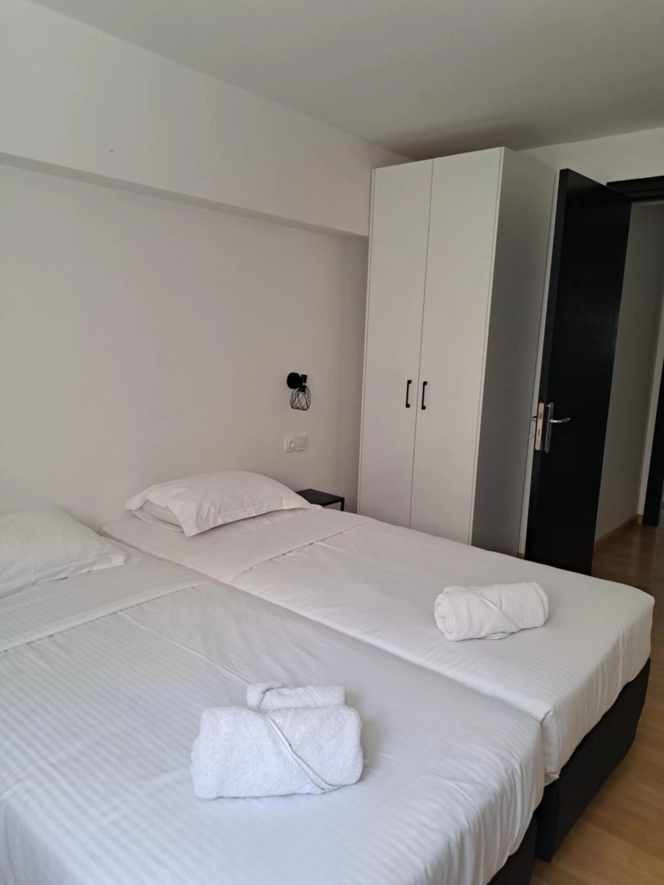 Bed in Evita's Luxury Apartments