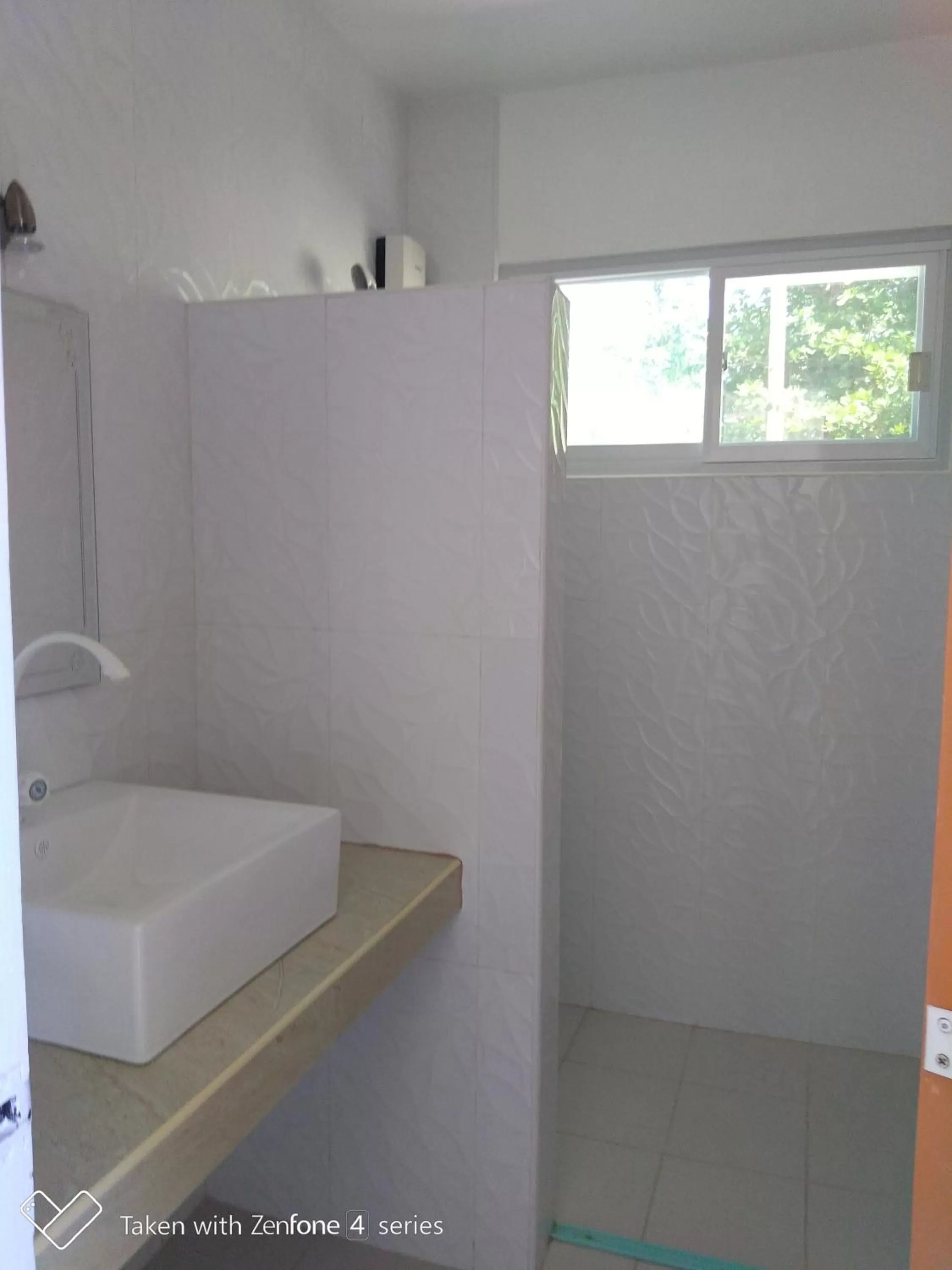Bathroom in D & B BLUESTAR BEACH RESORT