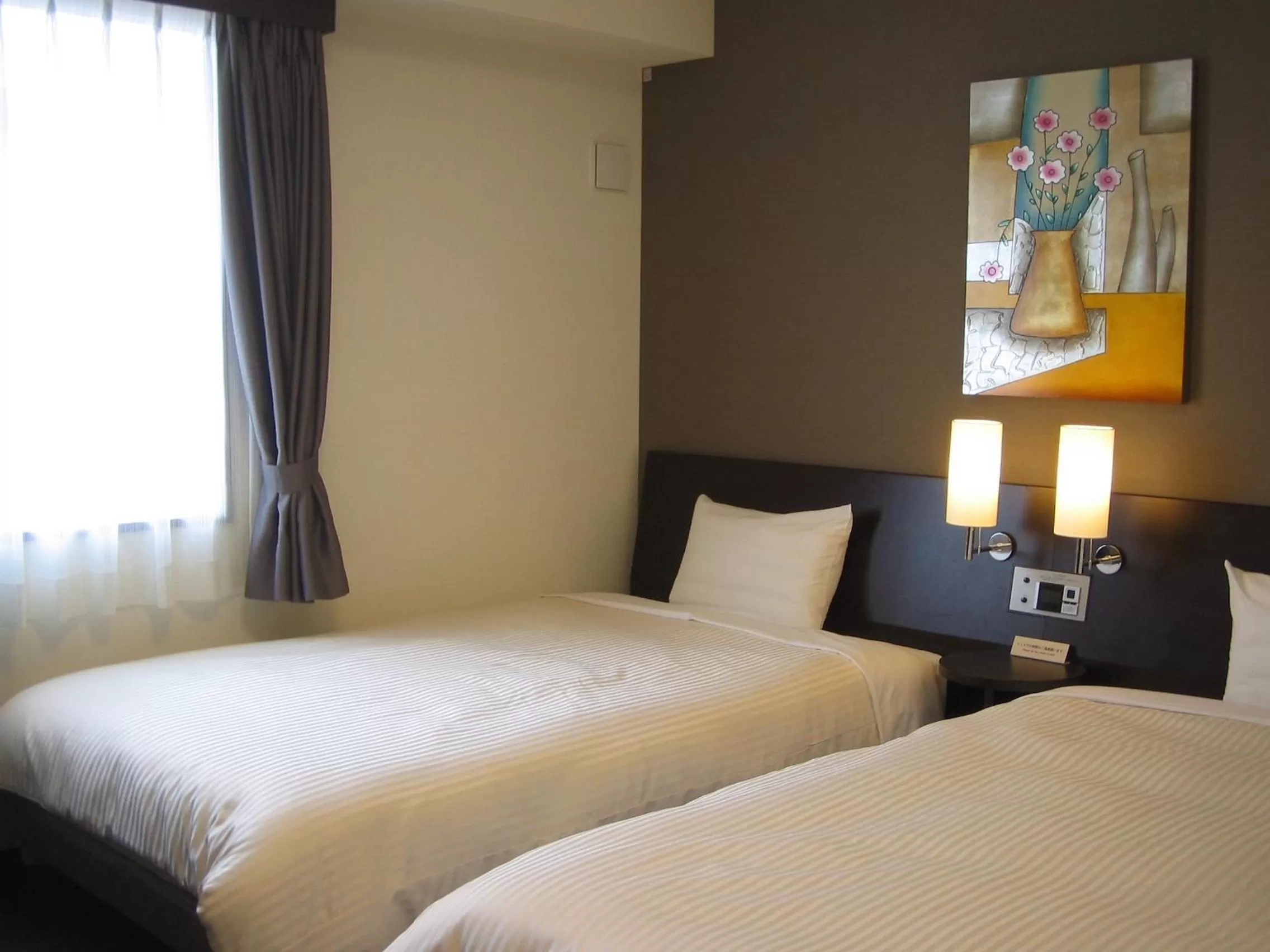 Bed in Hotel Route-Inn Kitakyushu-Wakamatsu Ekihigashi