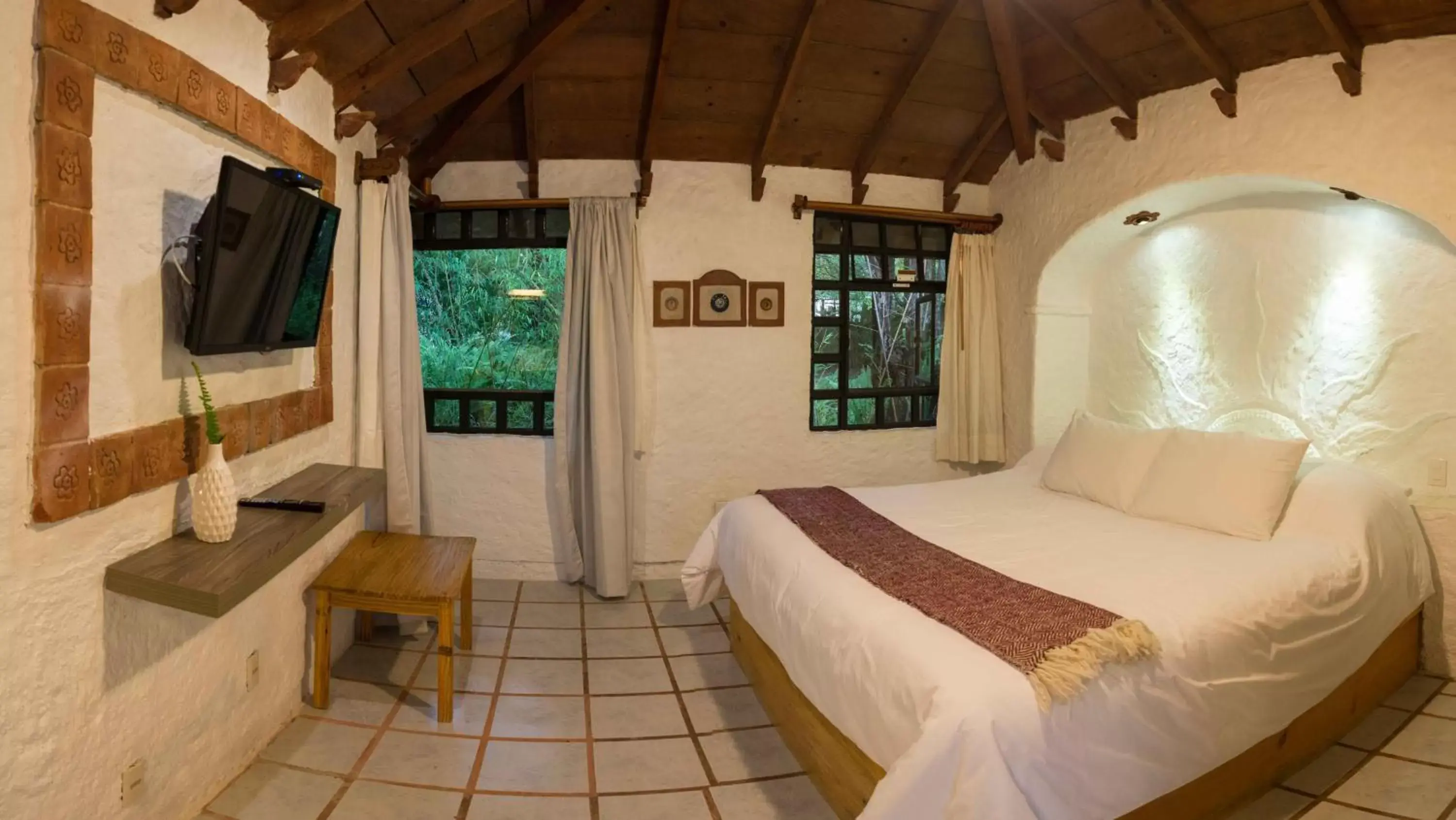 Bed in Hotel Bosques del Sol Suites