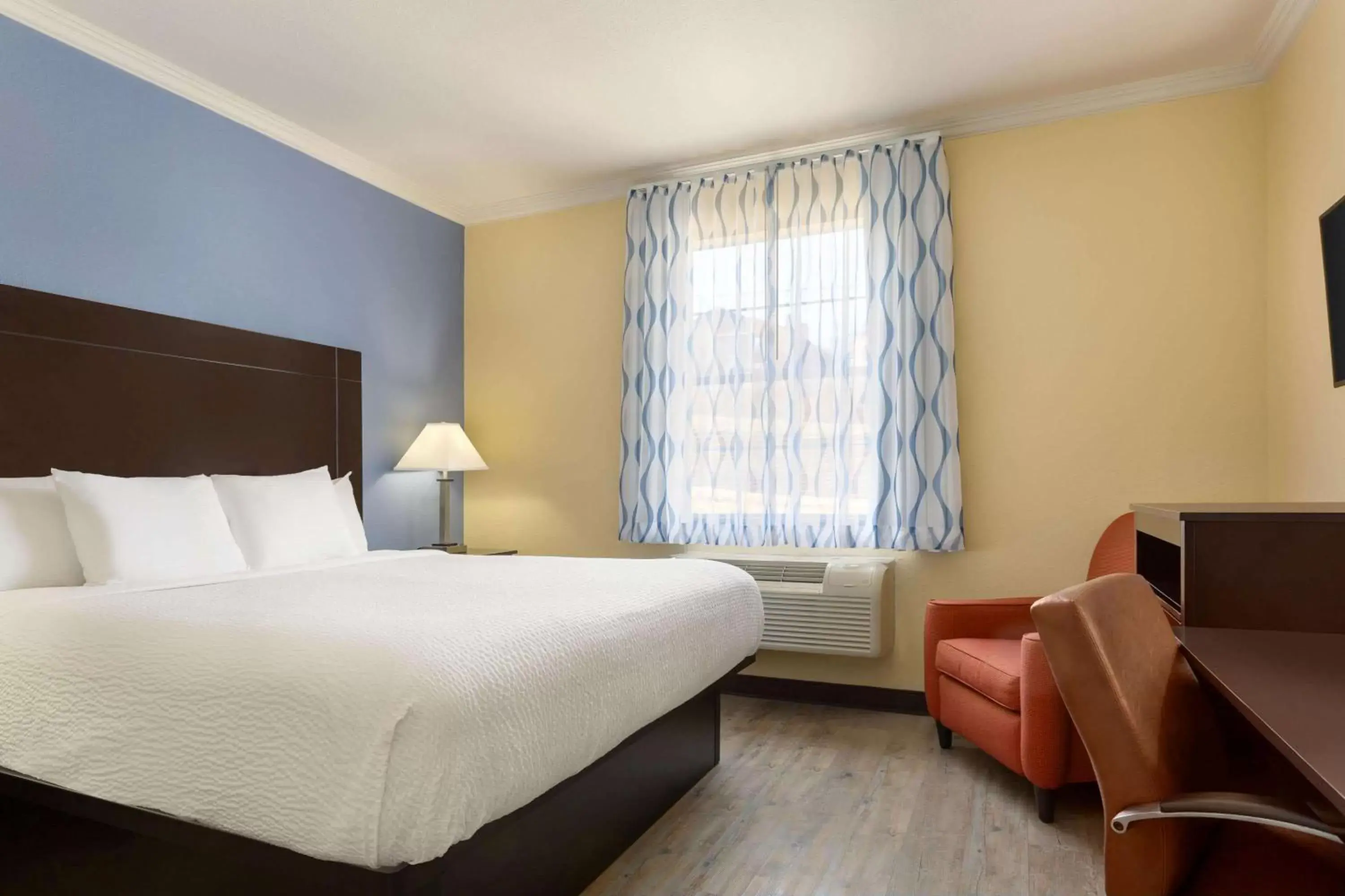 Photo of the whole room in Days Inn & Suites by Wyndham DFW Airport South-Euless