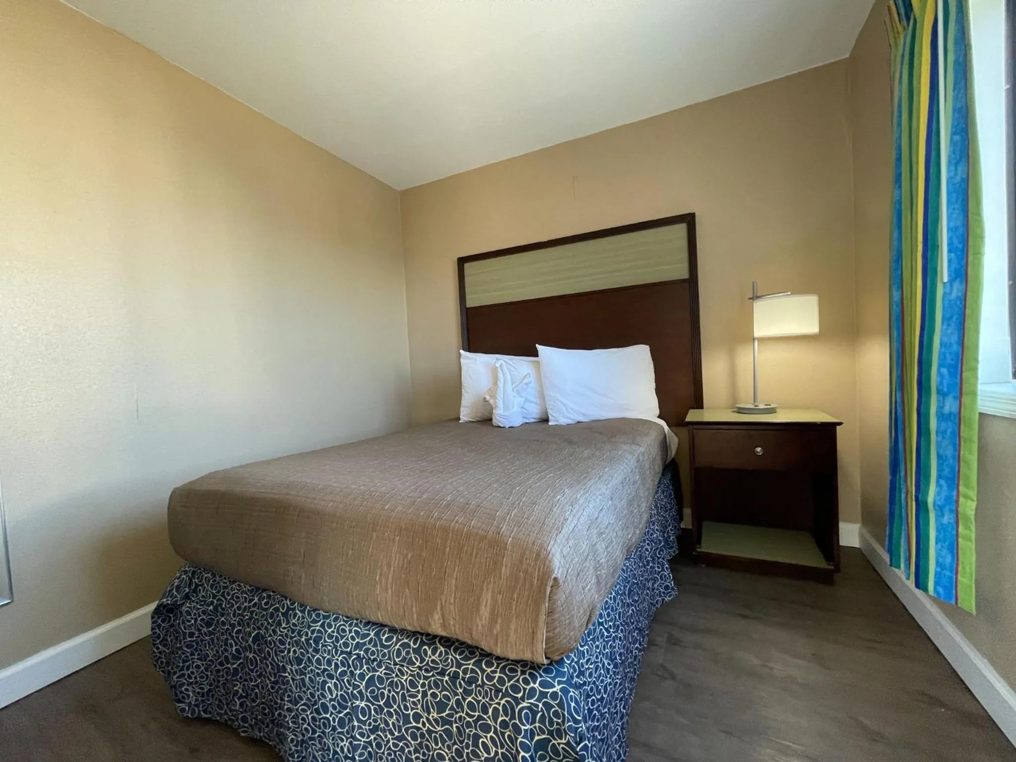 Bed in Polynesian Oceanfront Hotel