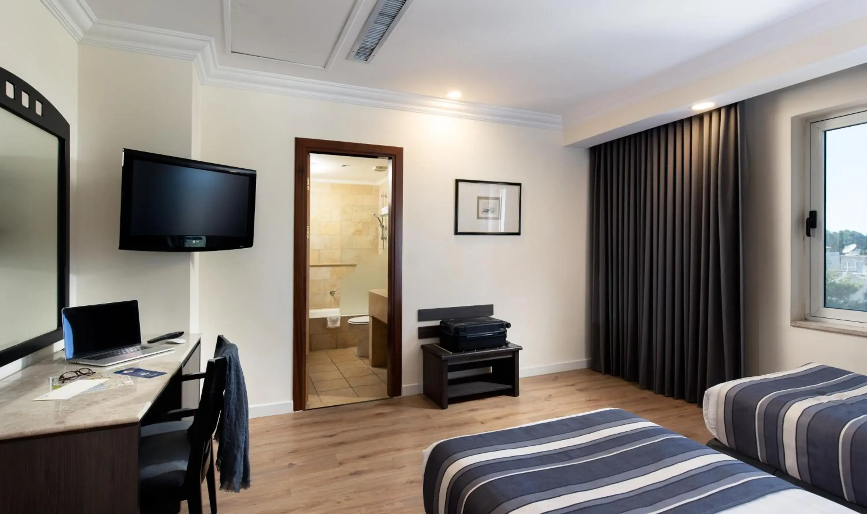 Seating area, TV/Entertainment Center in Ambassador Hotel