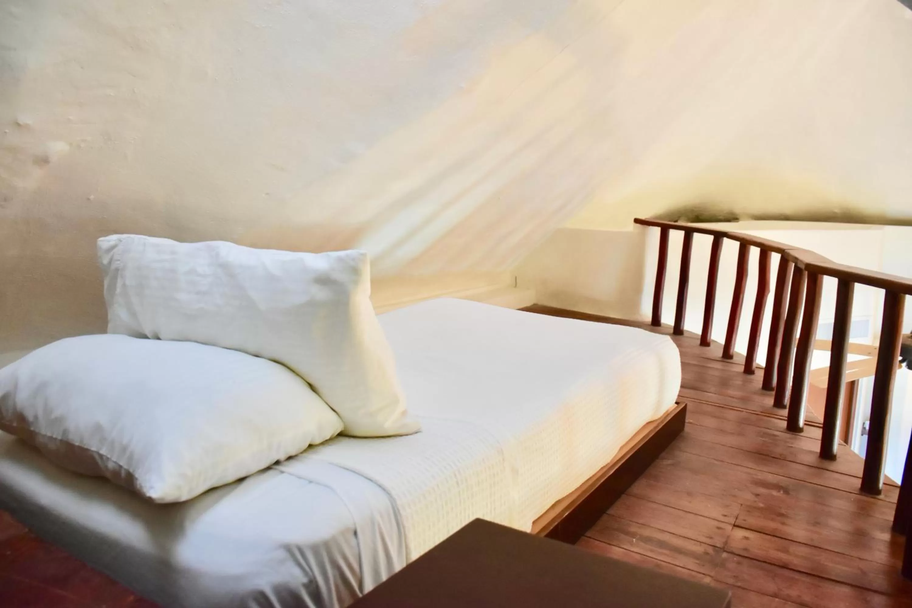 Bed in Playa Palms Beach Hotel