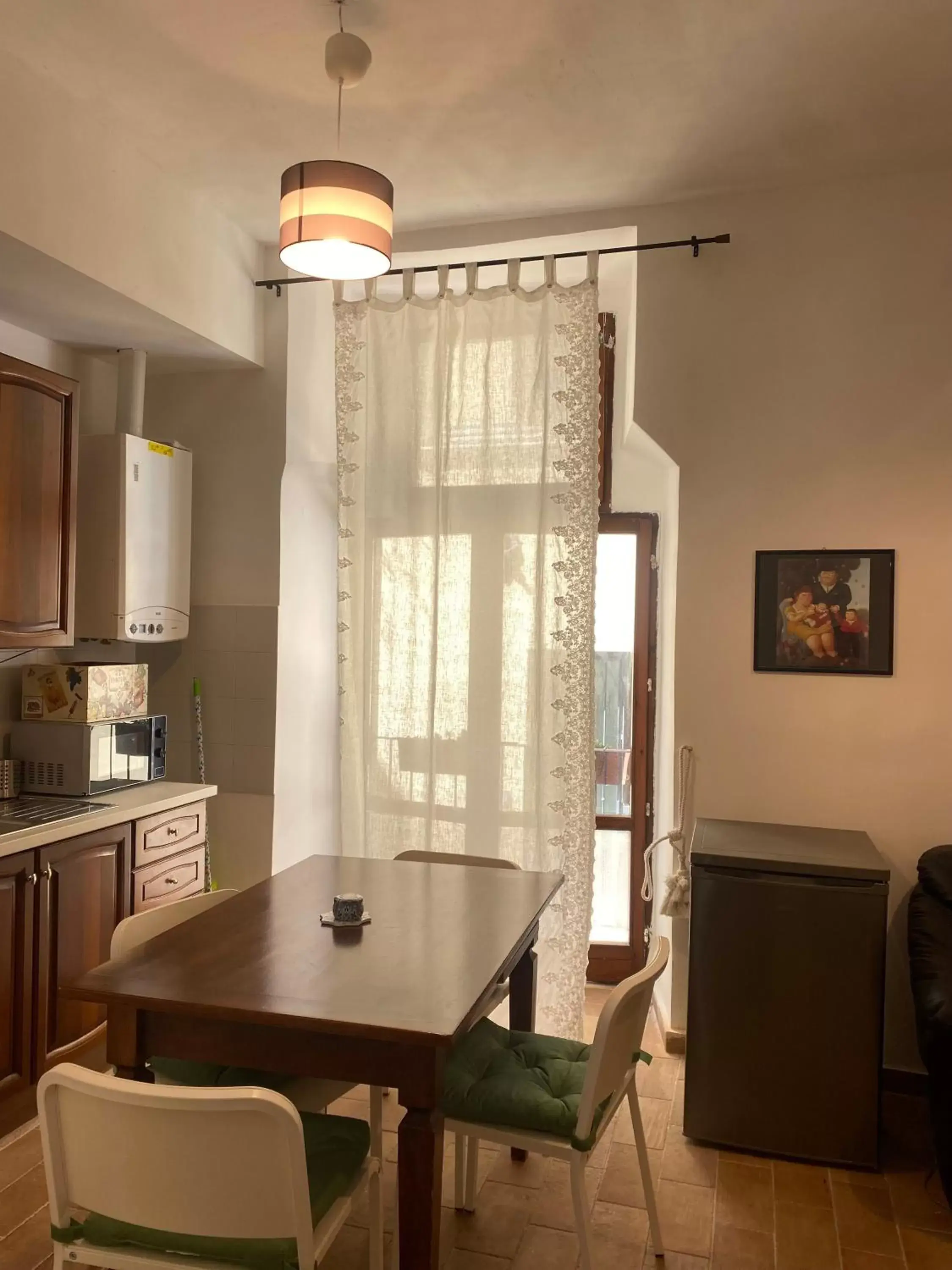 Kitchen/Kitchenette in Attico Luce B&B