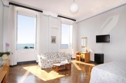 Seating area, Bed in Hotel Mediterranee