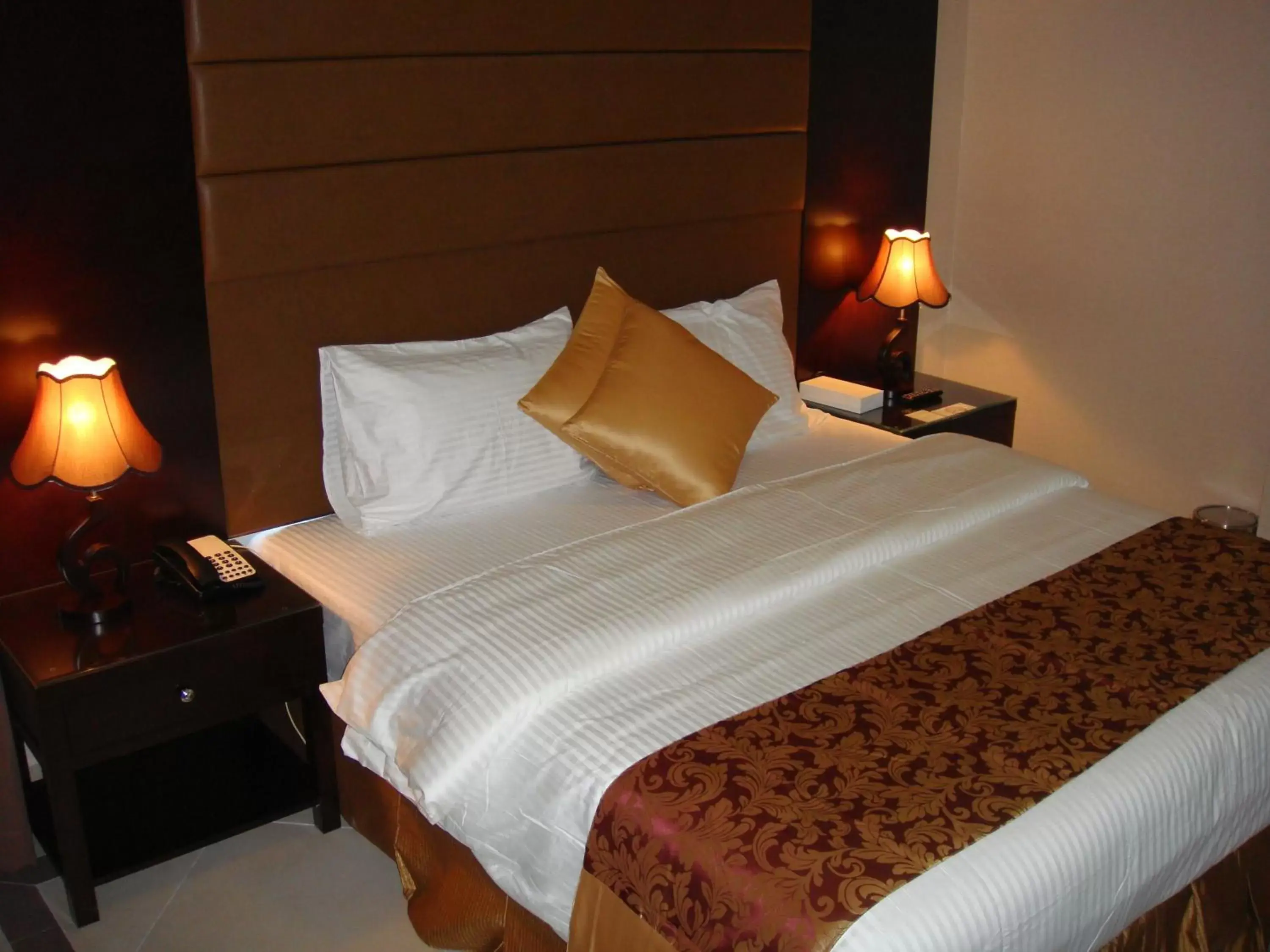 Bed in Paragon Hotel Apartments