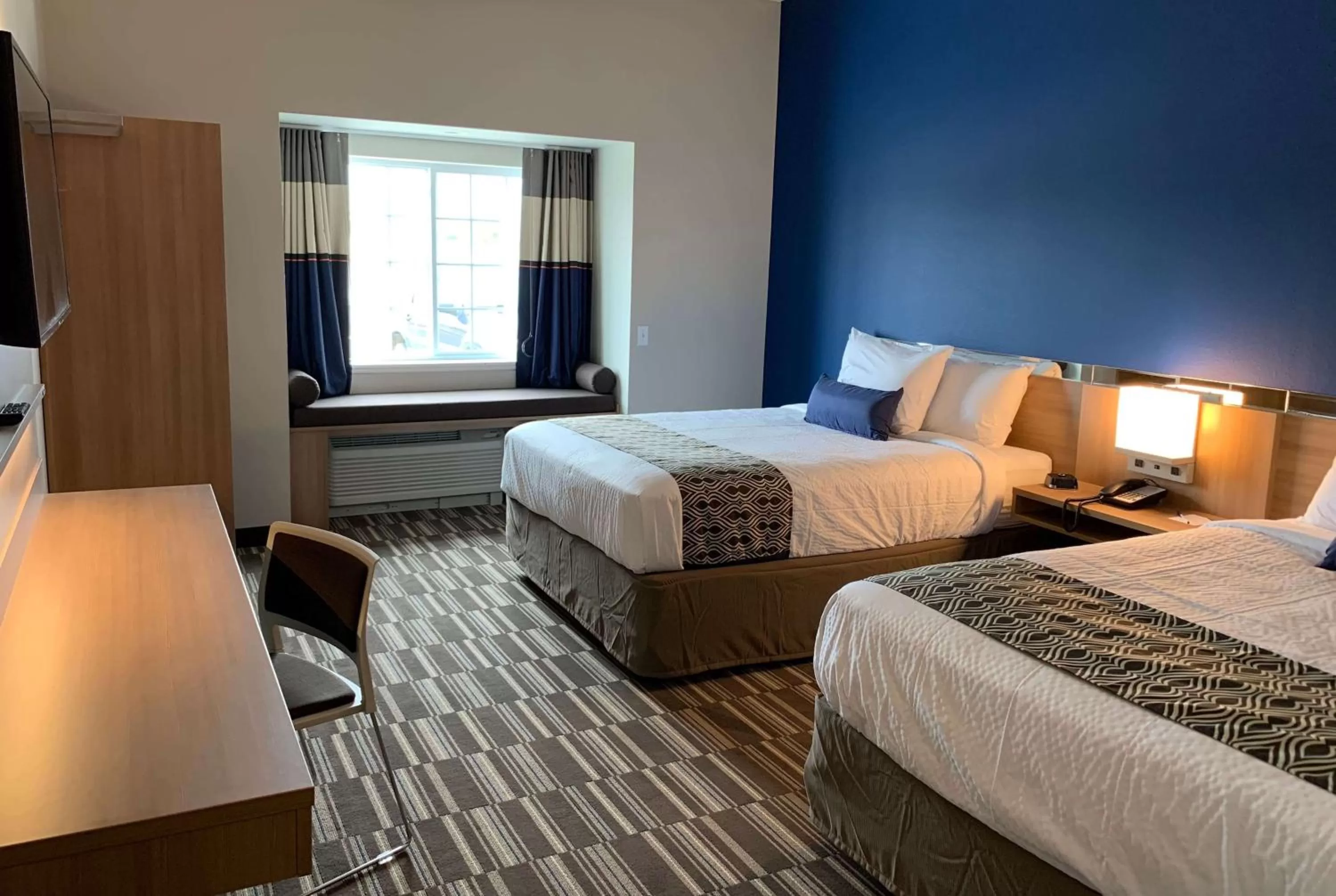 Photo of the whole room, Bed in Microtel Inn & Suites by Wyndham Fountain Fort Carson