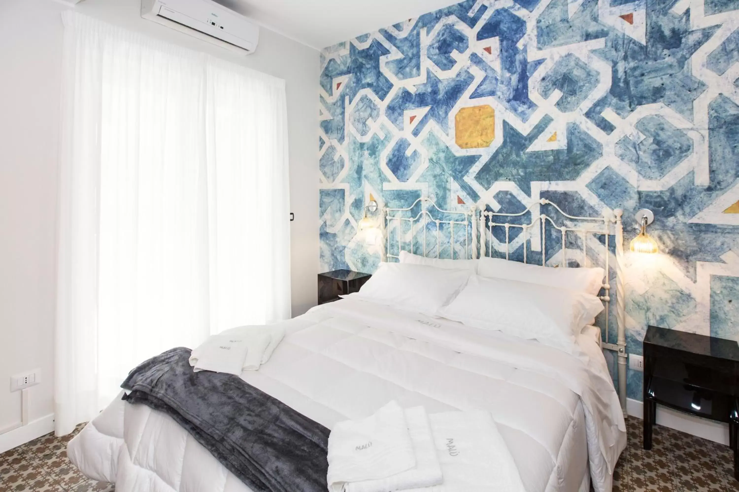 Bed in Malù Suites Bed in Malù Suites