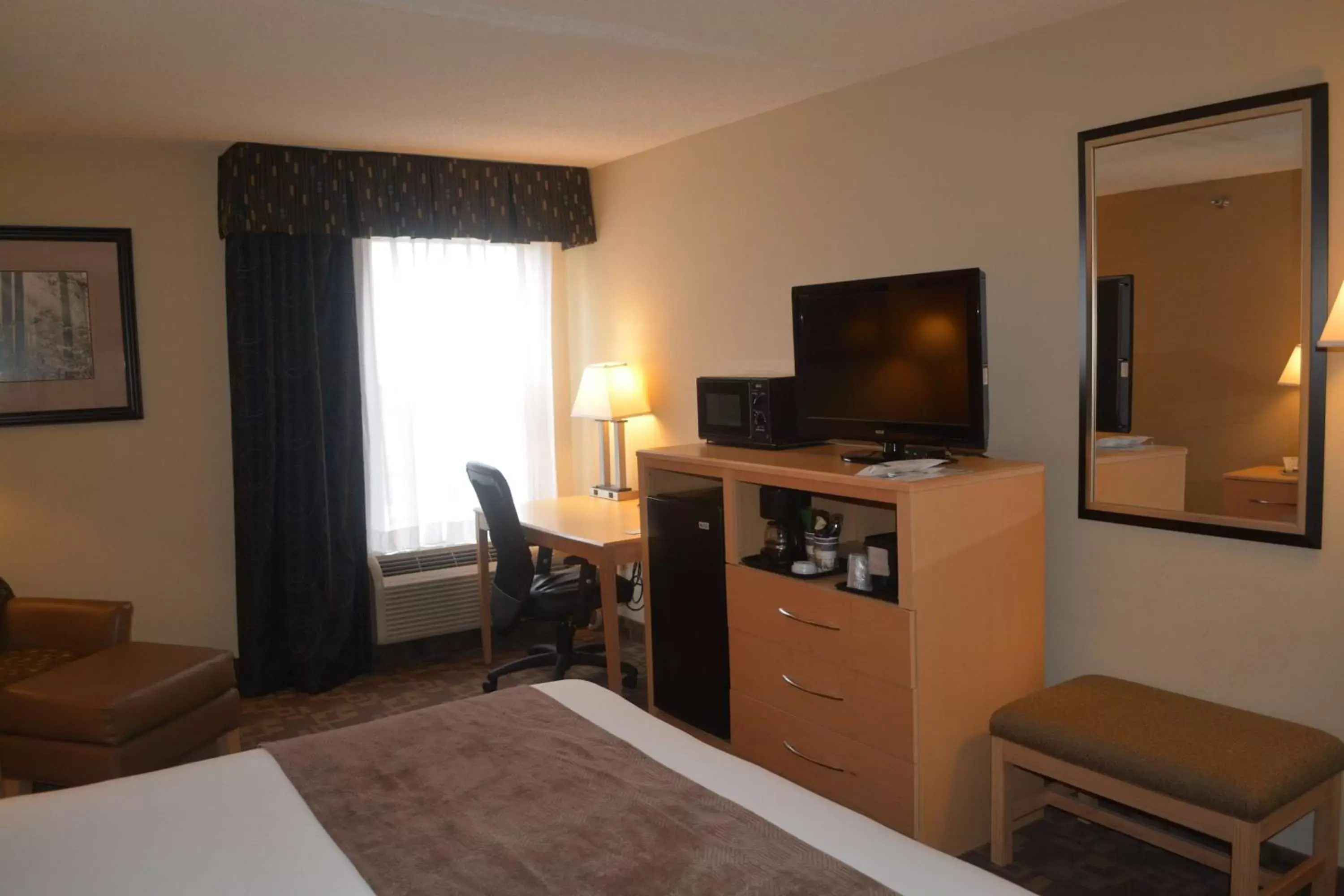 Photo of the whole room, TV/Entertainment Center in SureStay Plus Hotel by Best Western Roanoke Rapids I-95