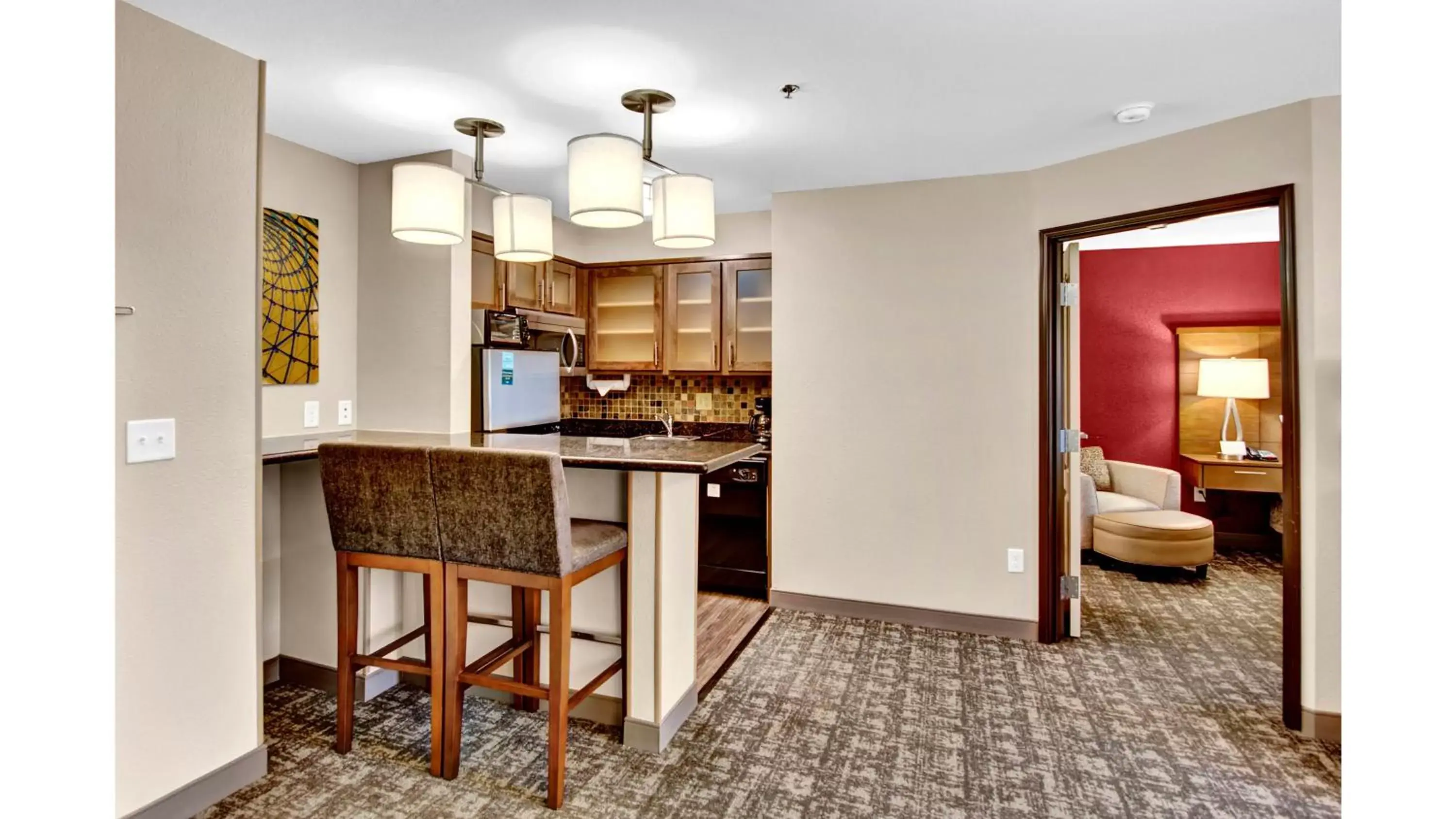 Photo of the whole room, Kitchen/Kitchenette in Staybridge Suites Salt Lake-West Valley City, an IHG Hotel