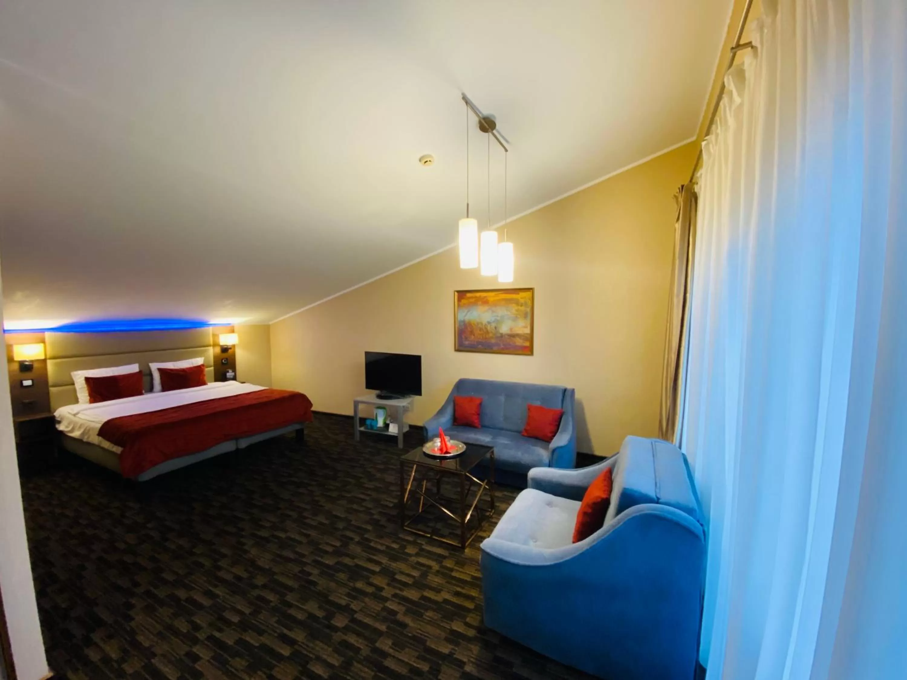 Photo of the whole room, Seating Area in Olympus Hotel