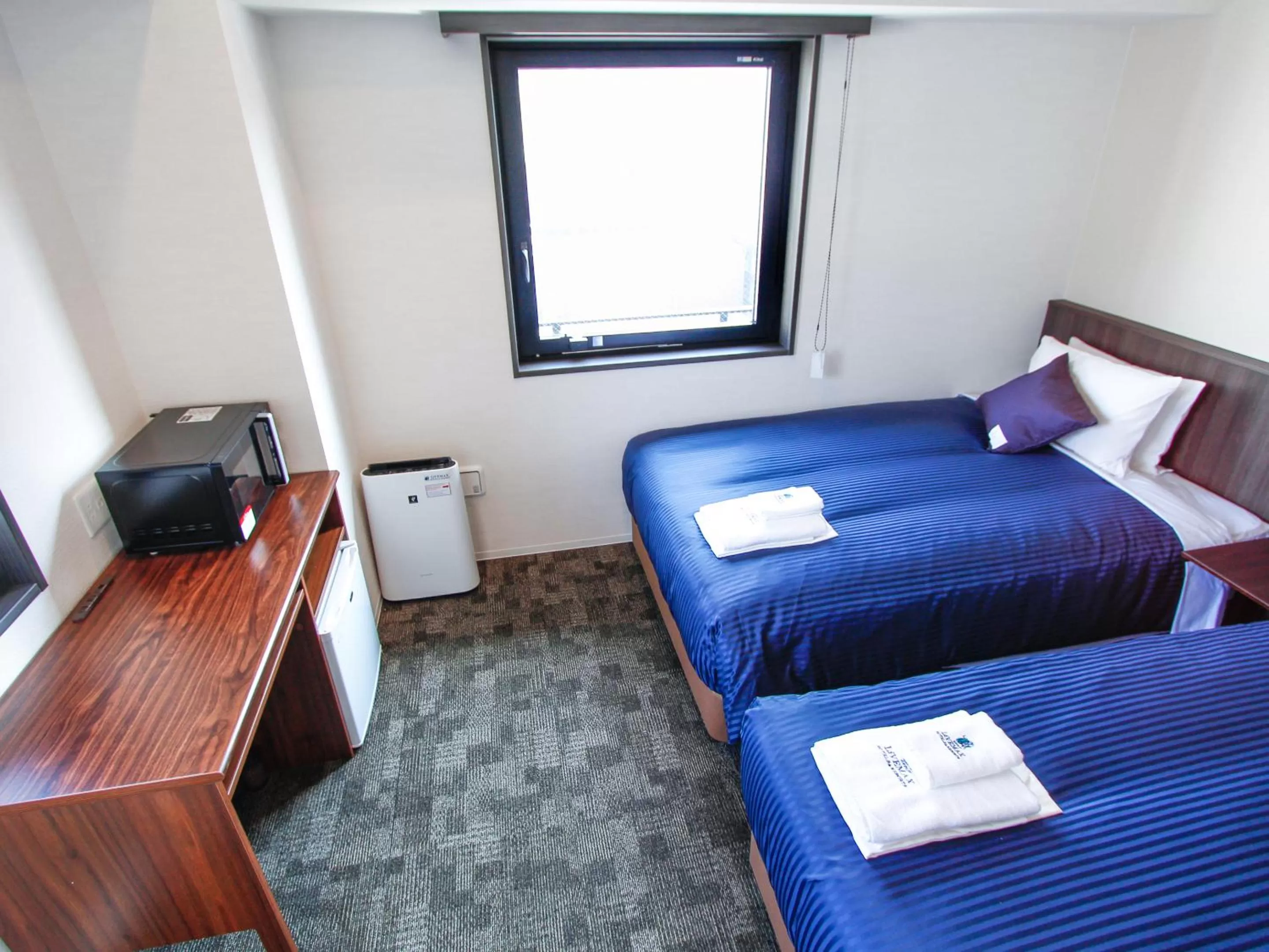 Bed in HOTEL LiVEMAX Osaka Yodoyabashi