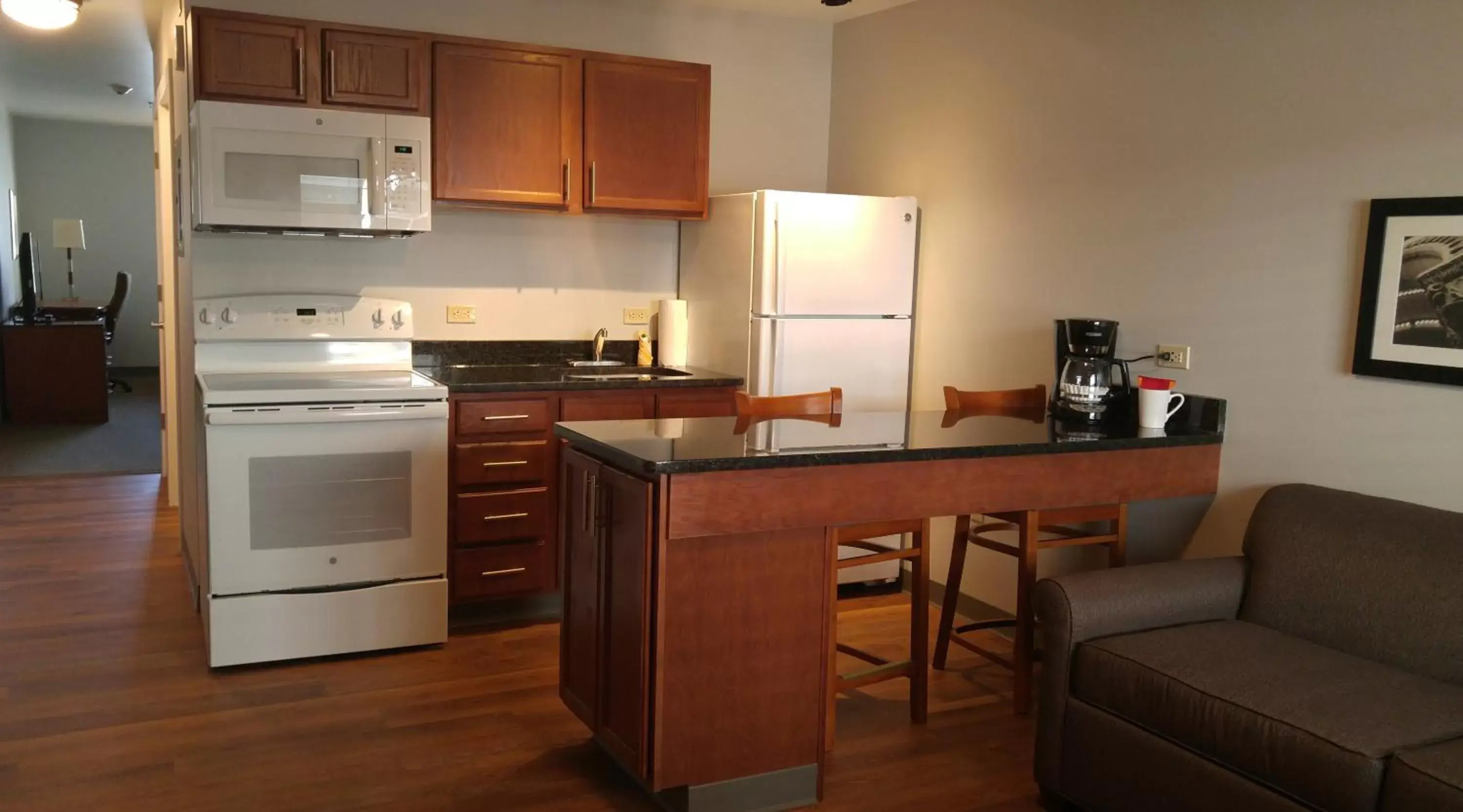 Photo of the whole room, Kitchen/Kitchenette in Affordable Suites of America Portage