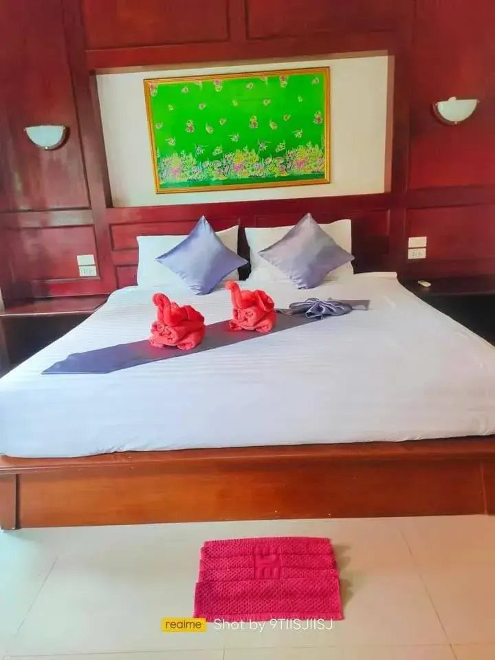 Bed in Tamarind Twin Resort