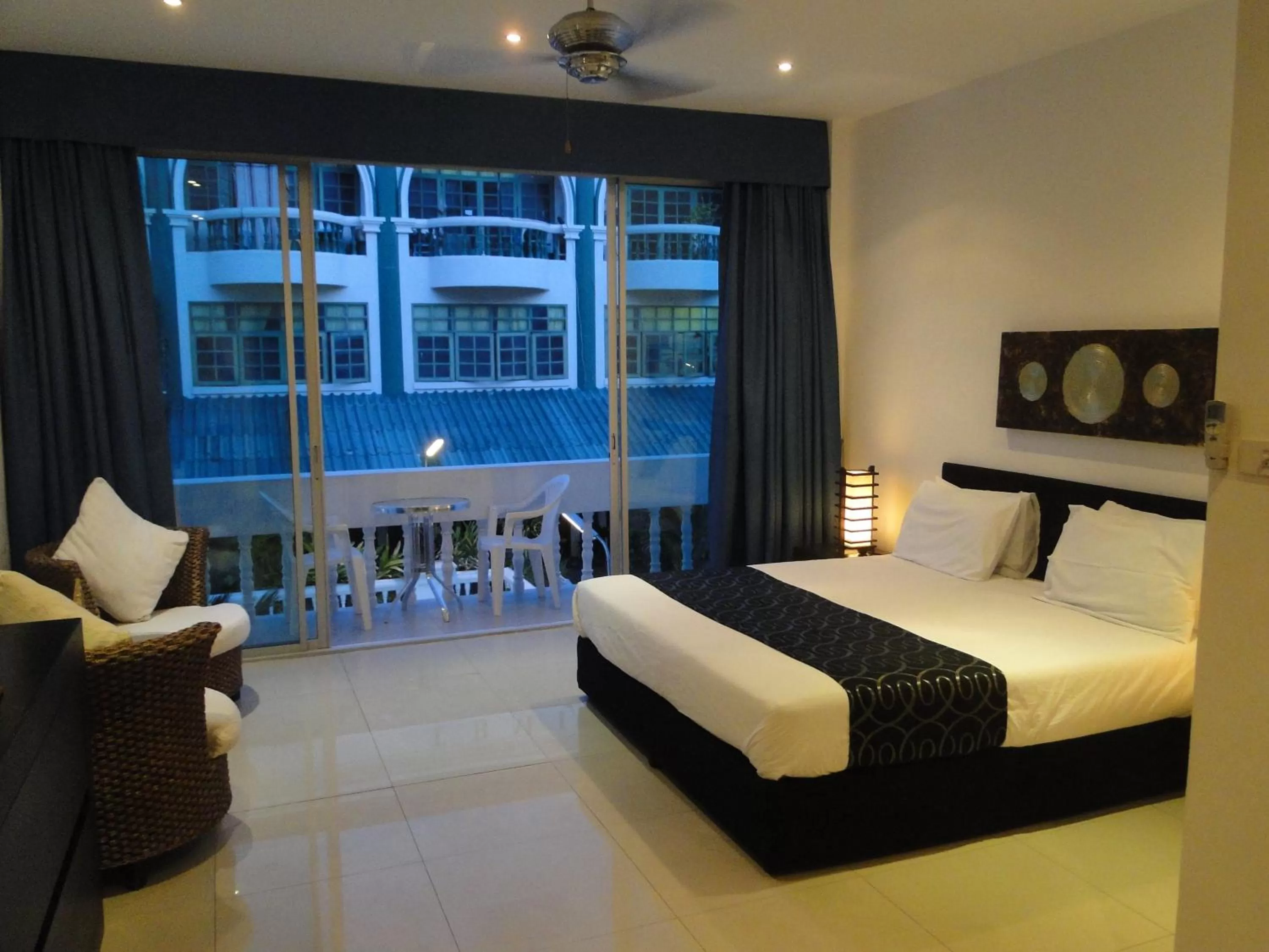 Photo of the whole room, Bed in East Suites