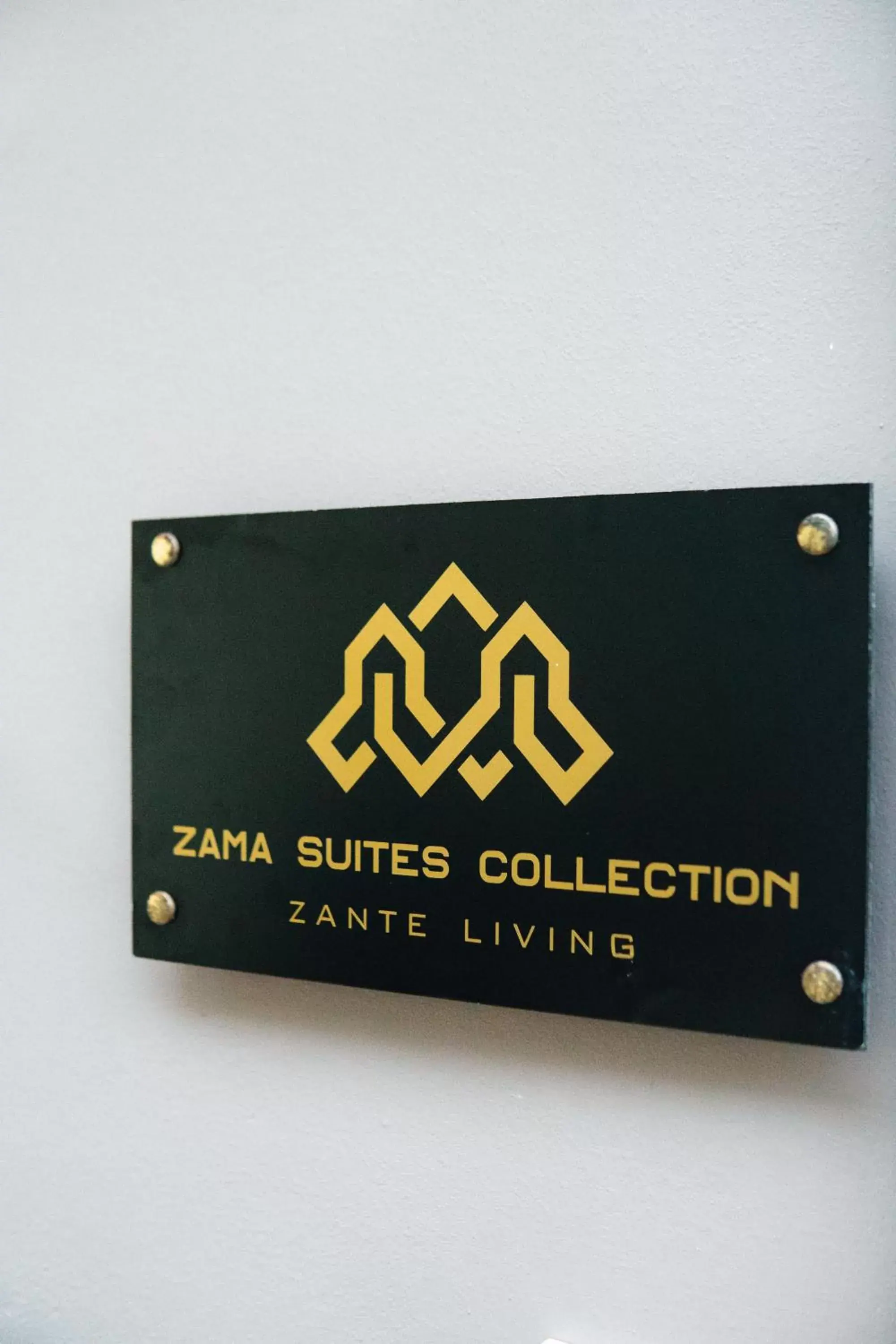 Property logo or sign in Zama Suites Collection