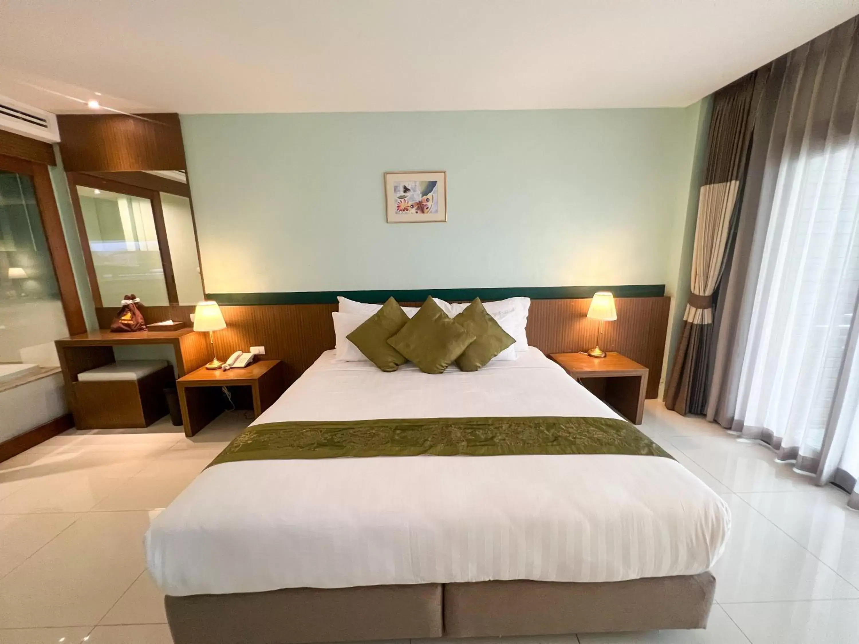 Bed in Siam Triangle Hotel