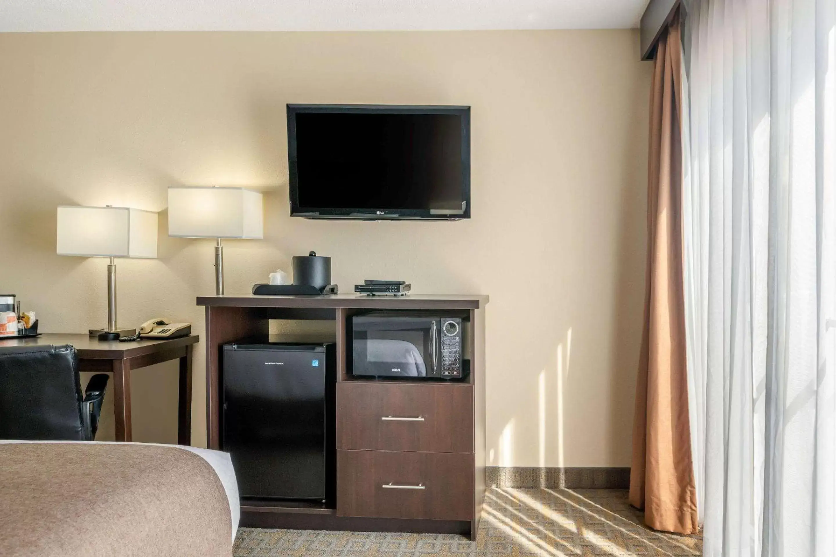 Photo of the whole room, TV/Entertainment Center in Quality Inn & Suites