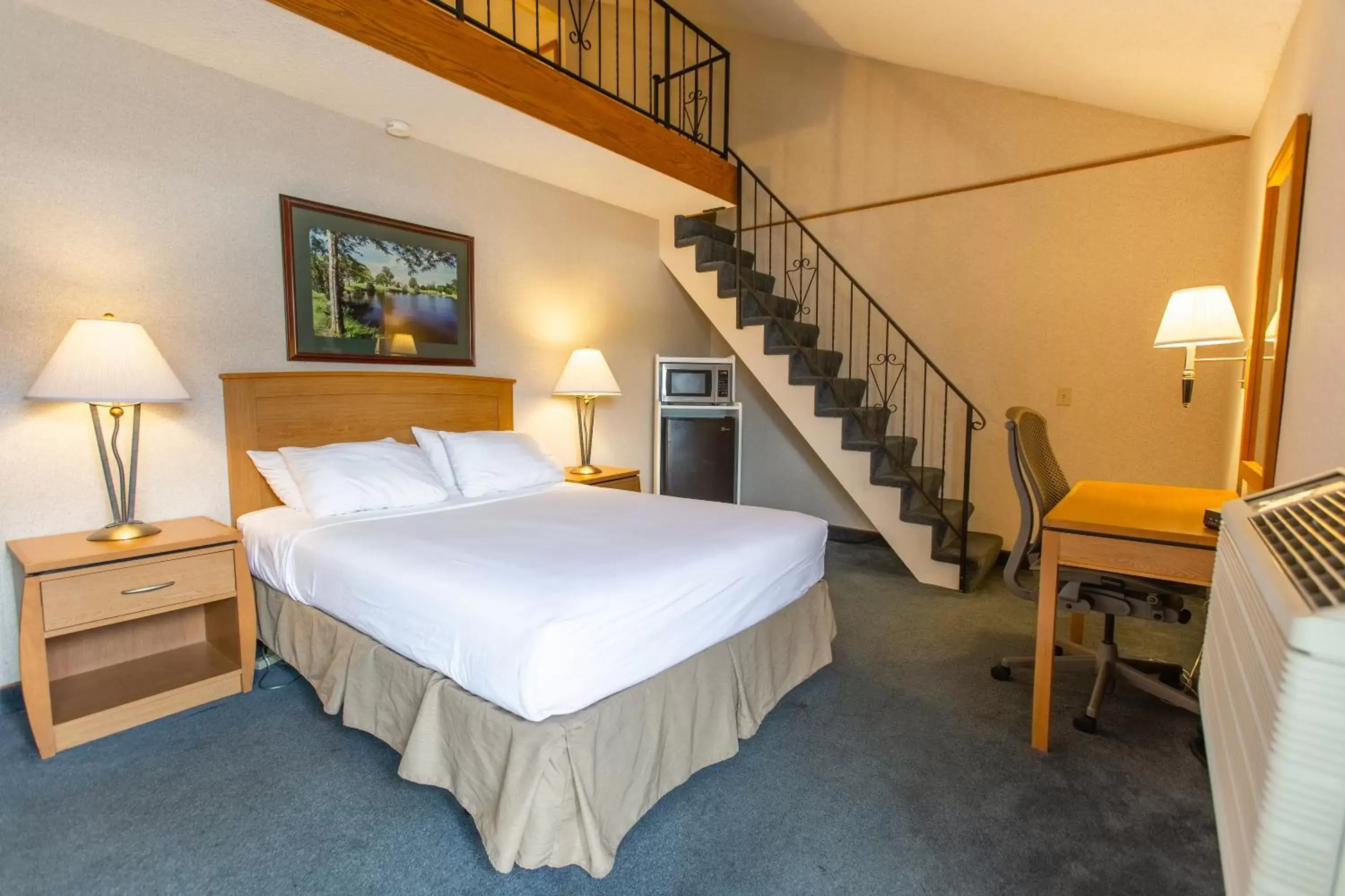 Bed in RiverTree Inn & Suites