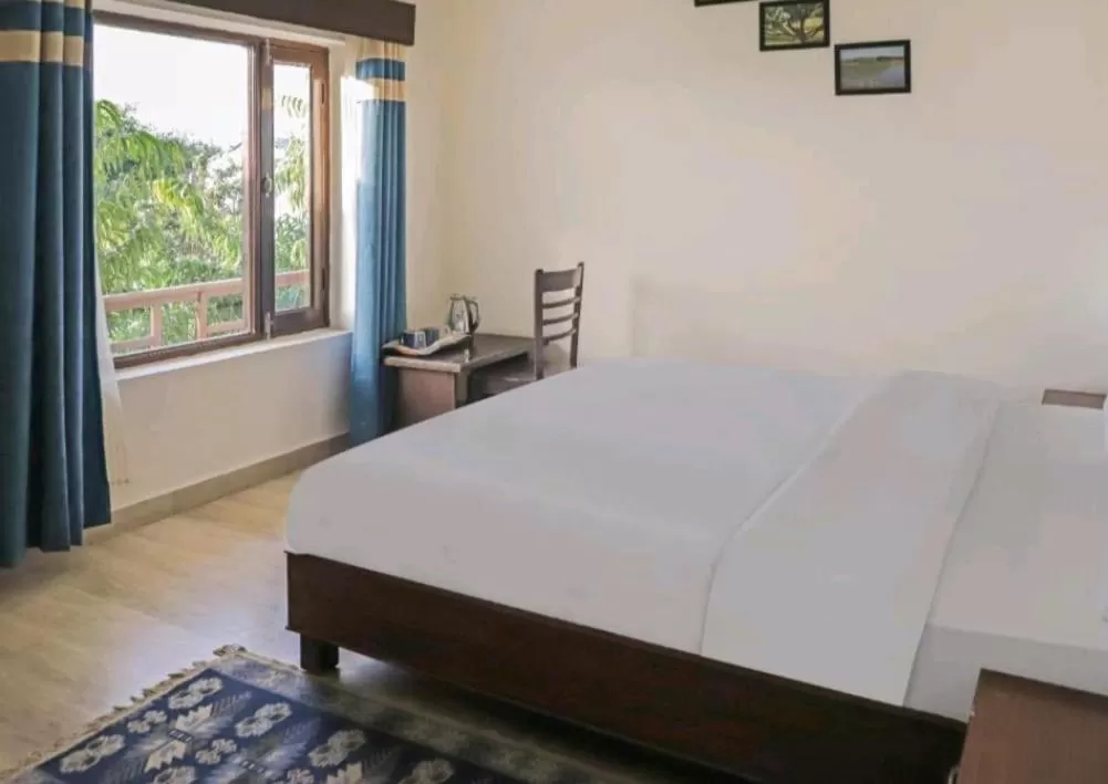 Bed in Hotel Ramayana Khajuraho