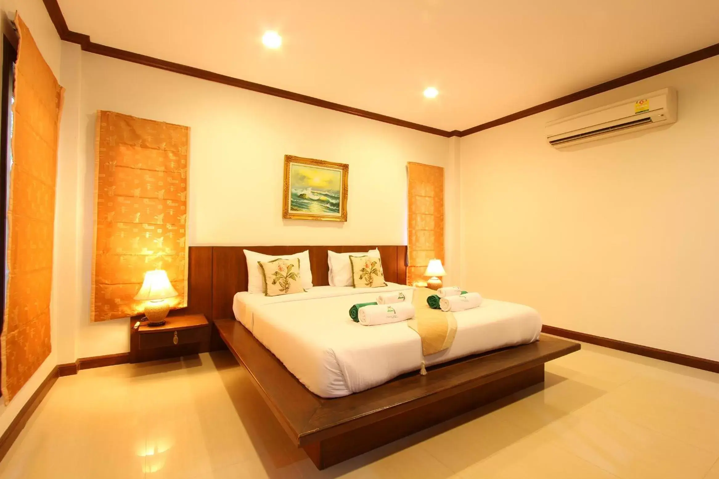 Bed in The Green Beach Resort