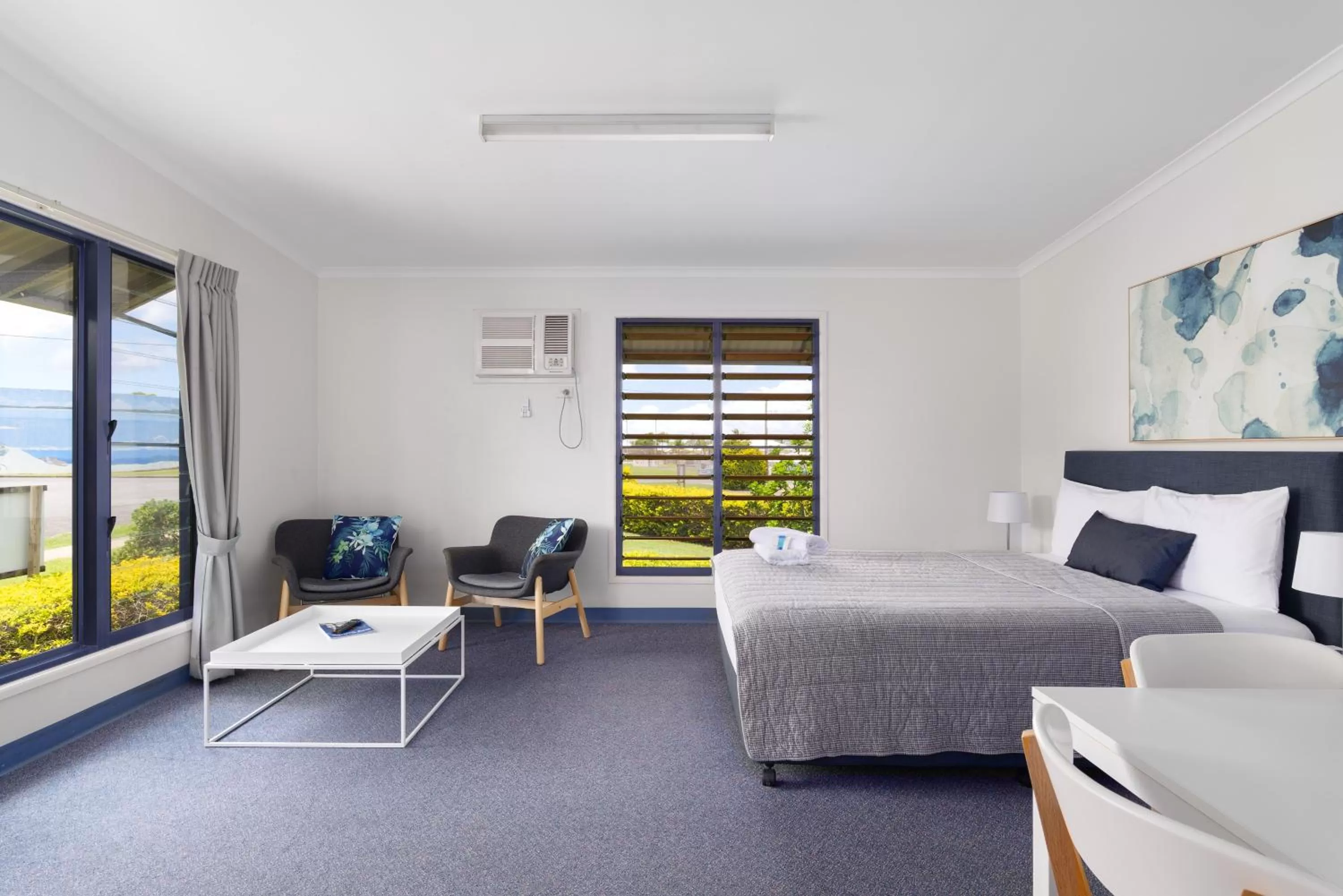 Seating area, Bed in Tin Can Bay's Sleepy Lagoon Motel