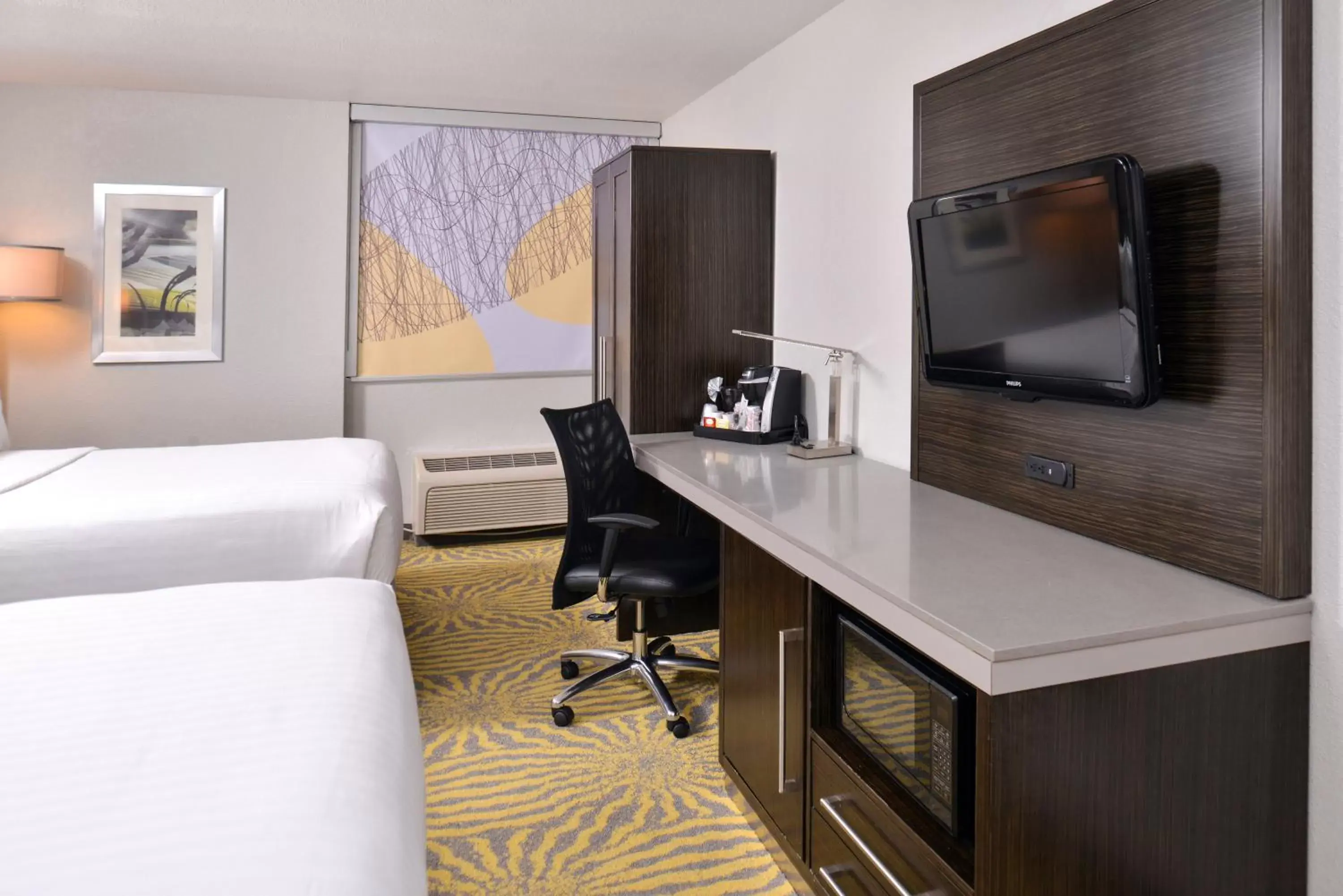Photo of the whole room, TV/Entertainment Center in Holiday Inn Richardson, an IHG Hotel