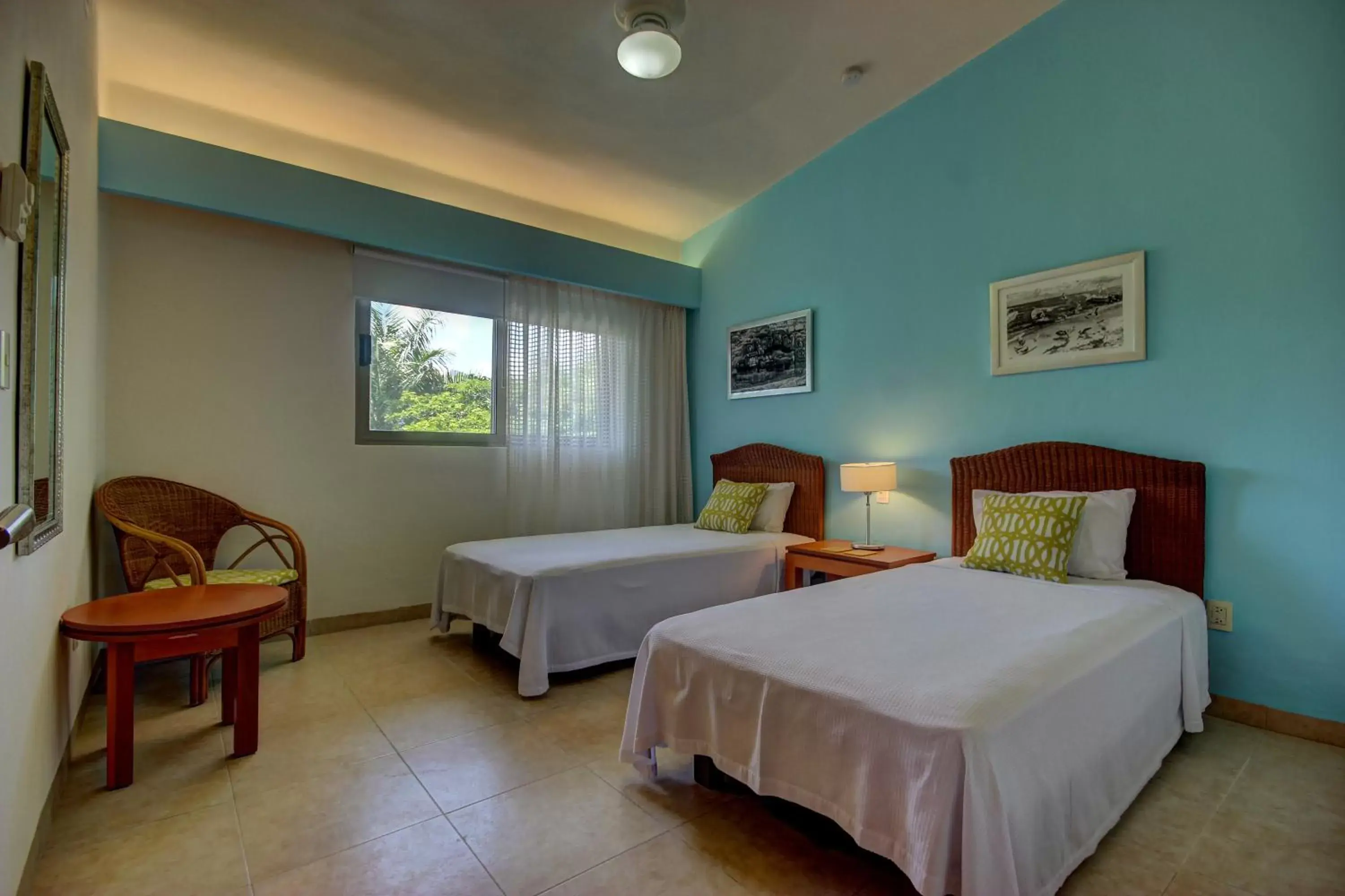Bed in Riviera Maya Suites