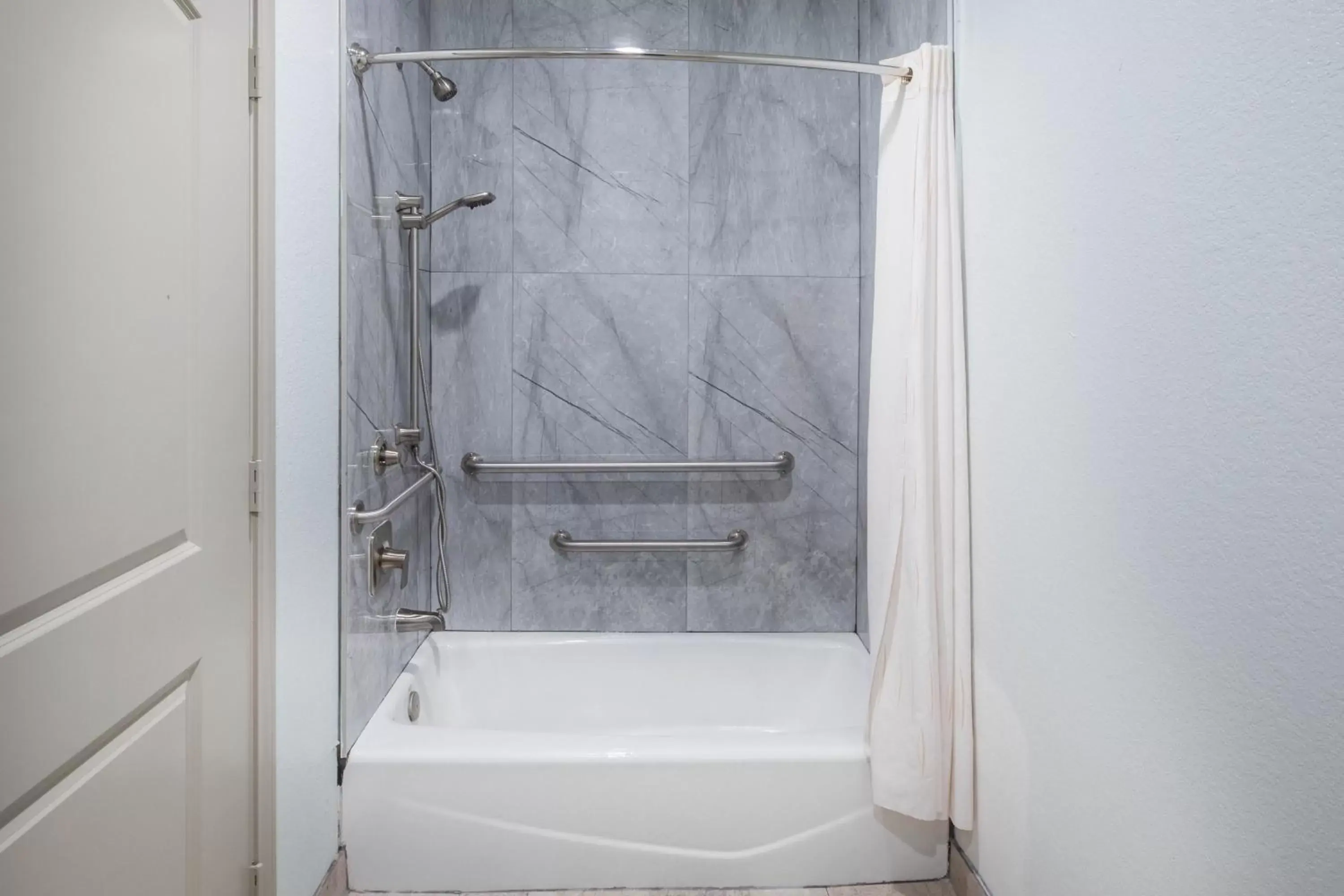Shower, Bathroom in Super 8 by Wyndham Humble/Houston