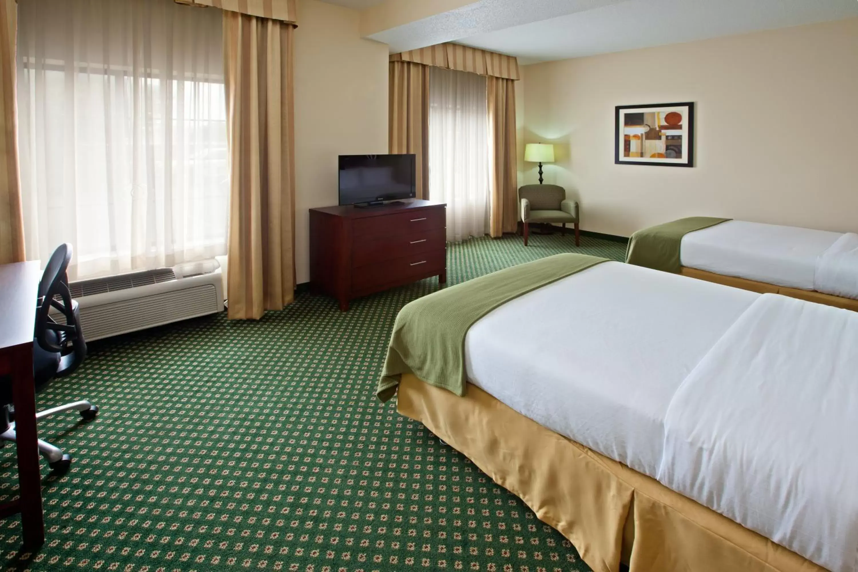 Photo of the whole room, TV/Entertainment Center in Holiday Inn Express Hotel & Suites Indianapolis - East, an IHG Hotel