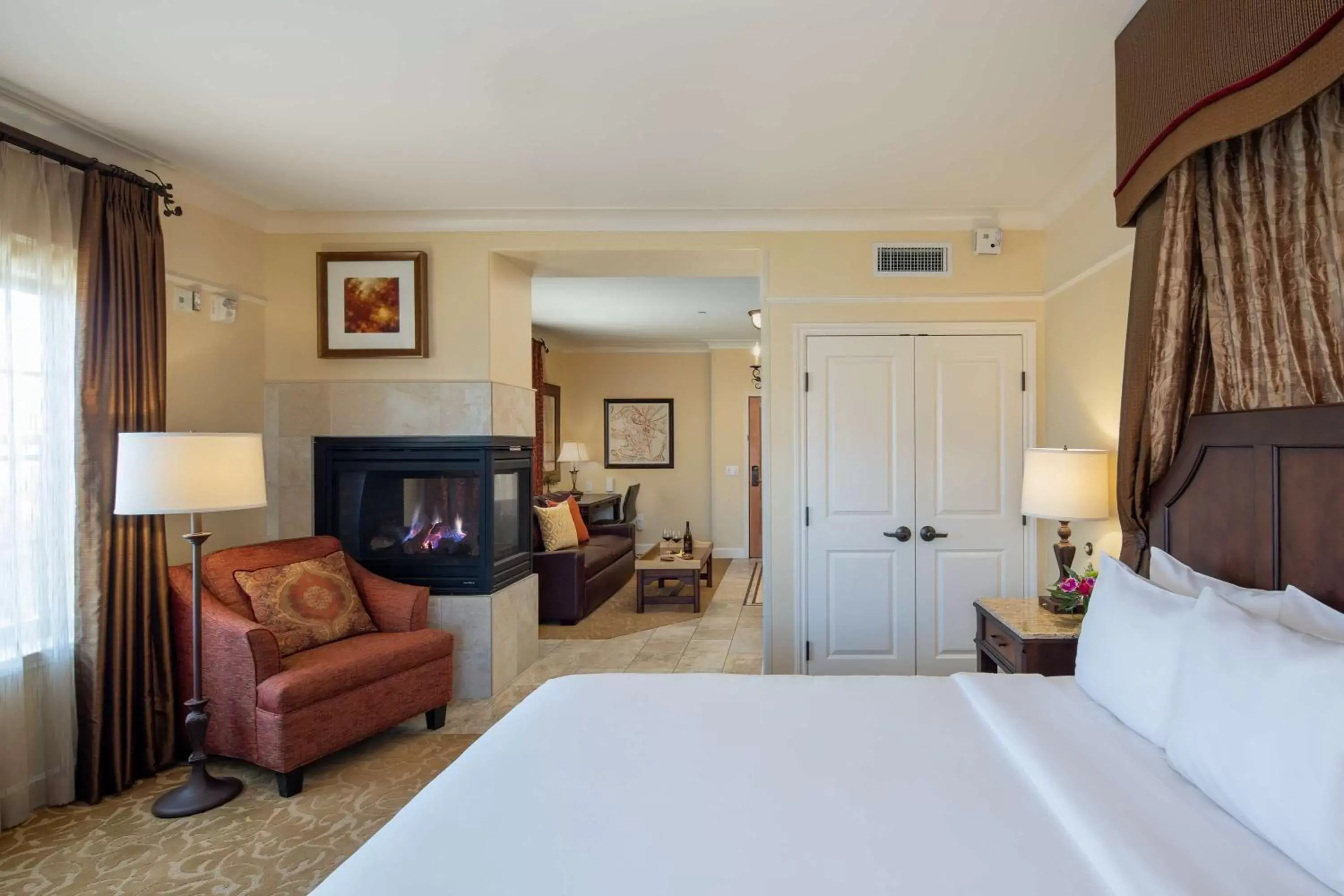 Bed, TV/Entertainment Center in The Meritage Resort and Spa