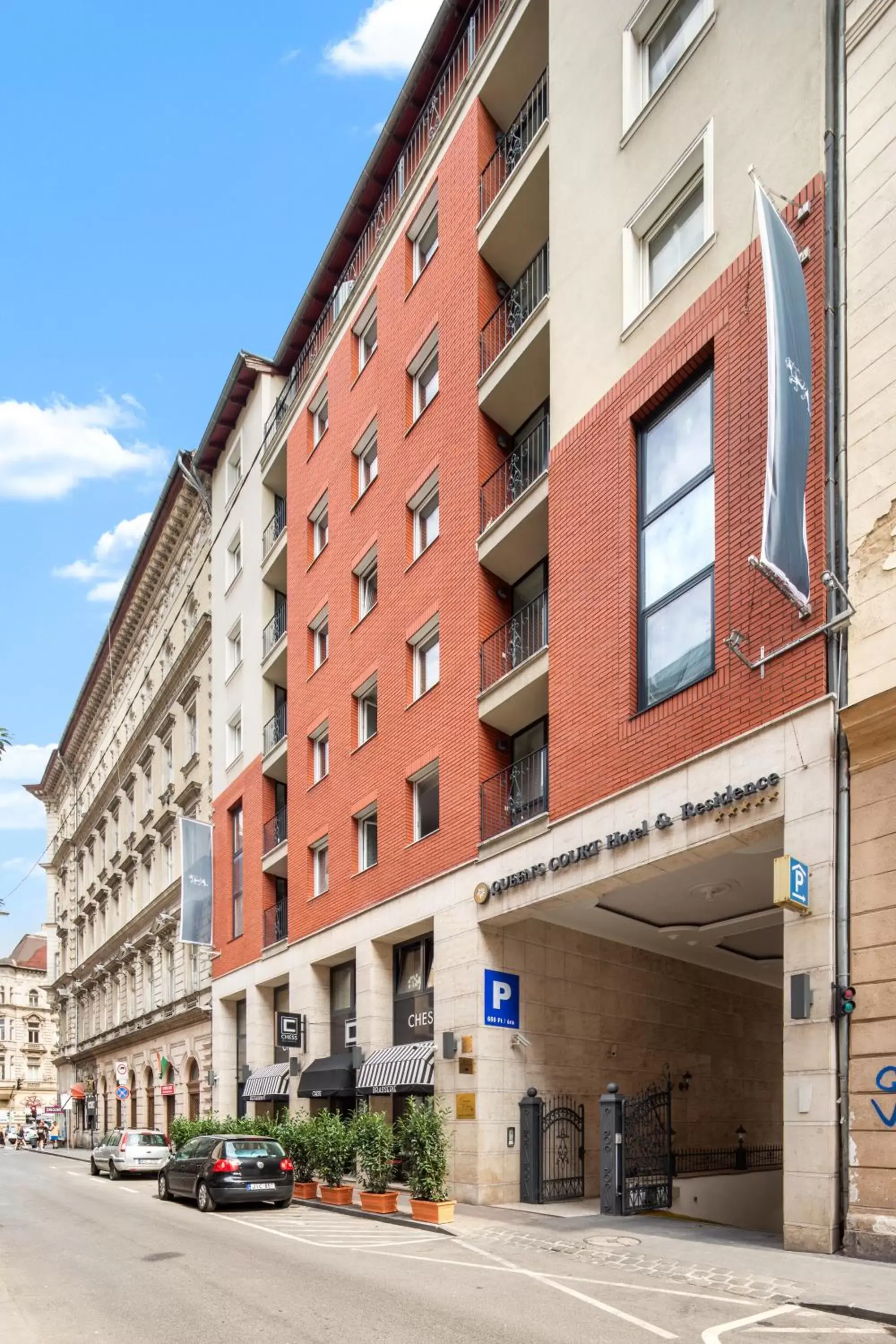 Property building in Queen's Court Hotel & Residence Property building in Queen's Court Hotel & Residence