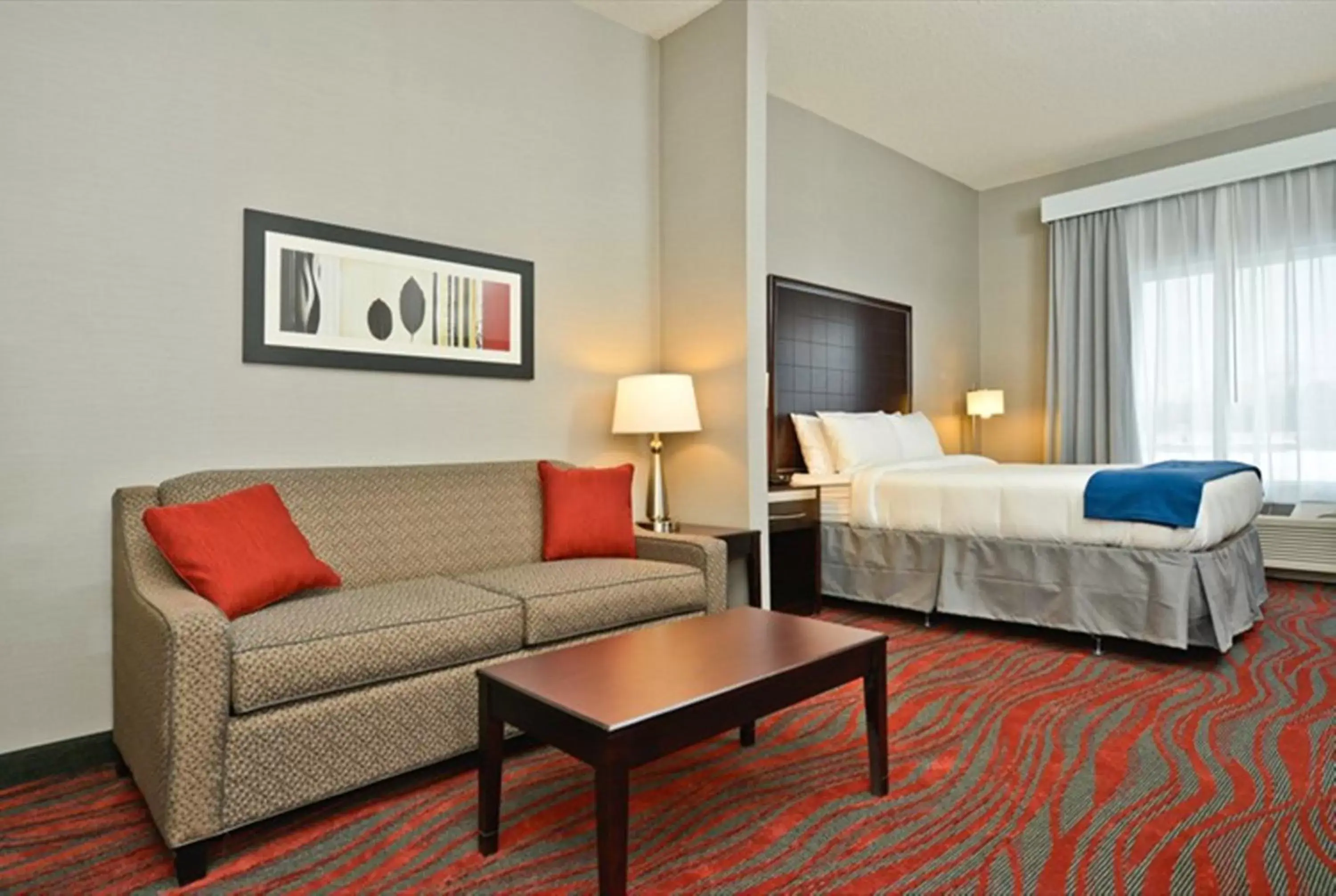 Bedroom in Holiday Inn Express & Suites Utica, an IHG Hotel