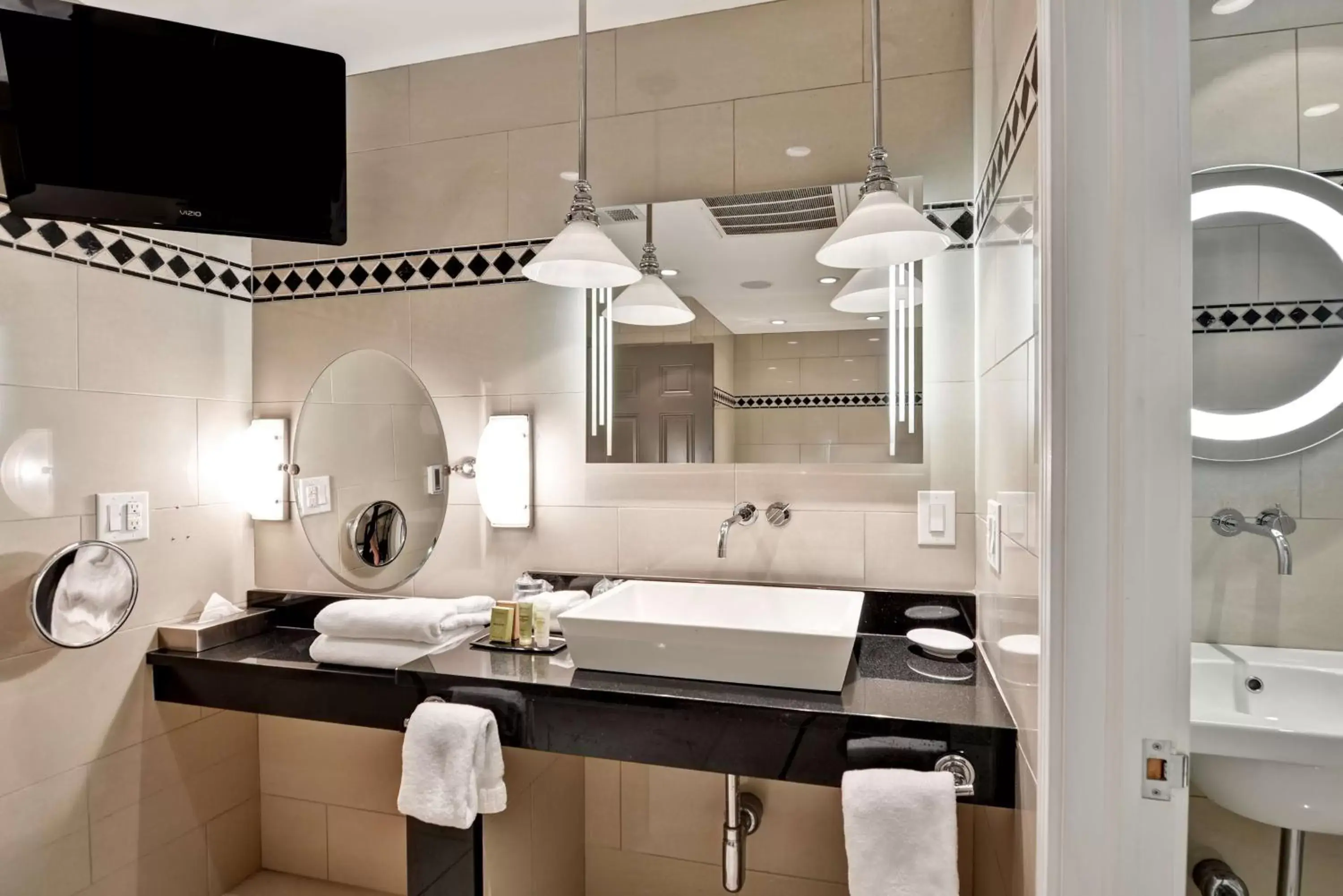 Bathroom in The Cincinnatian Curio Collection by Hilton