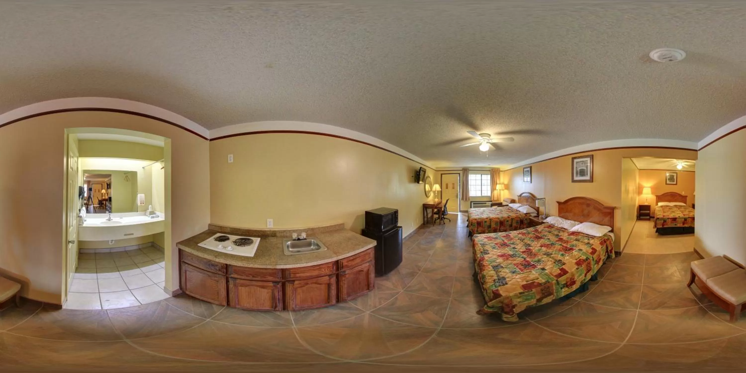 Bed in Deluxe Inn and Suites