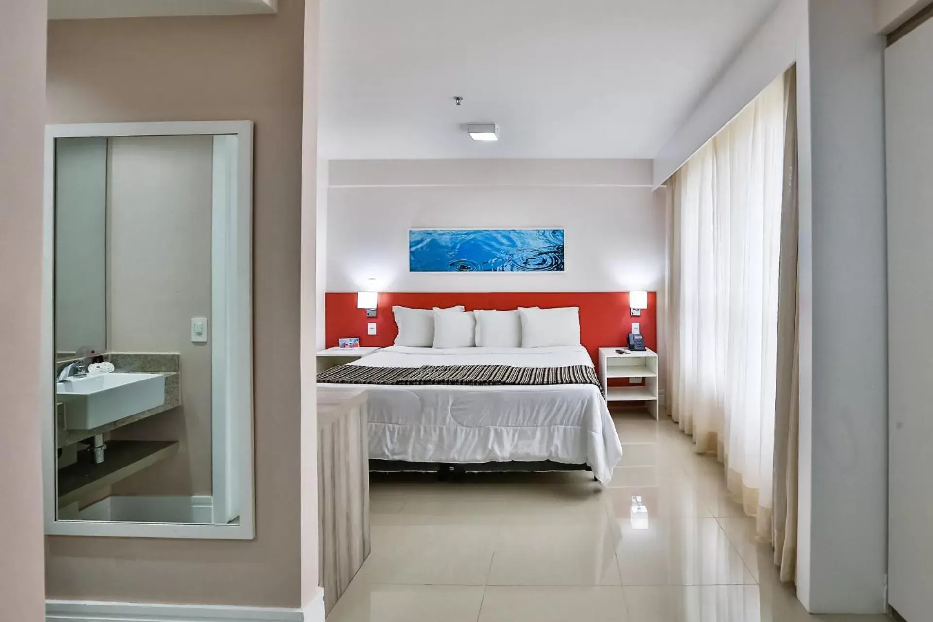 Bed in Ramada Hotel & Suites Campos Pelinca