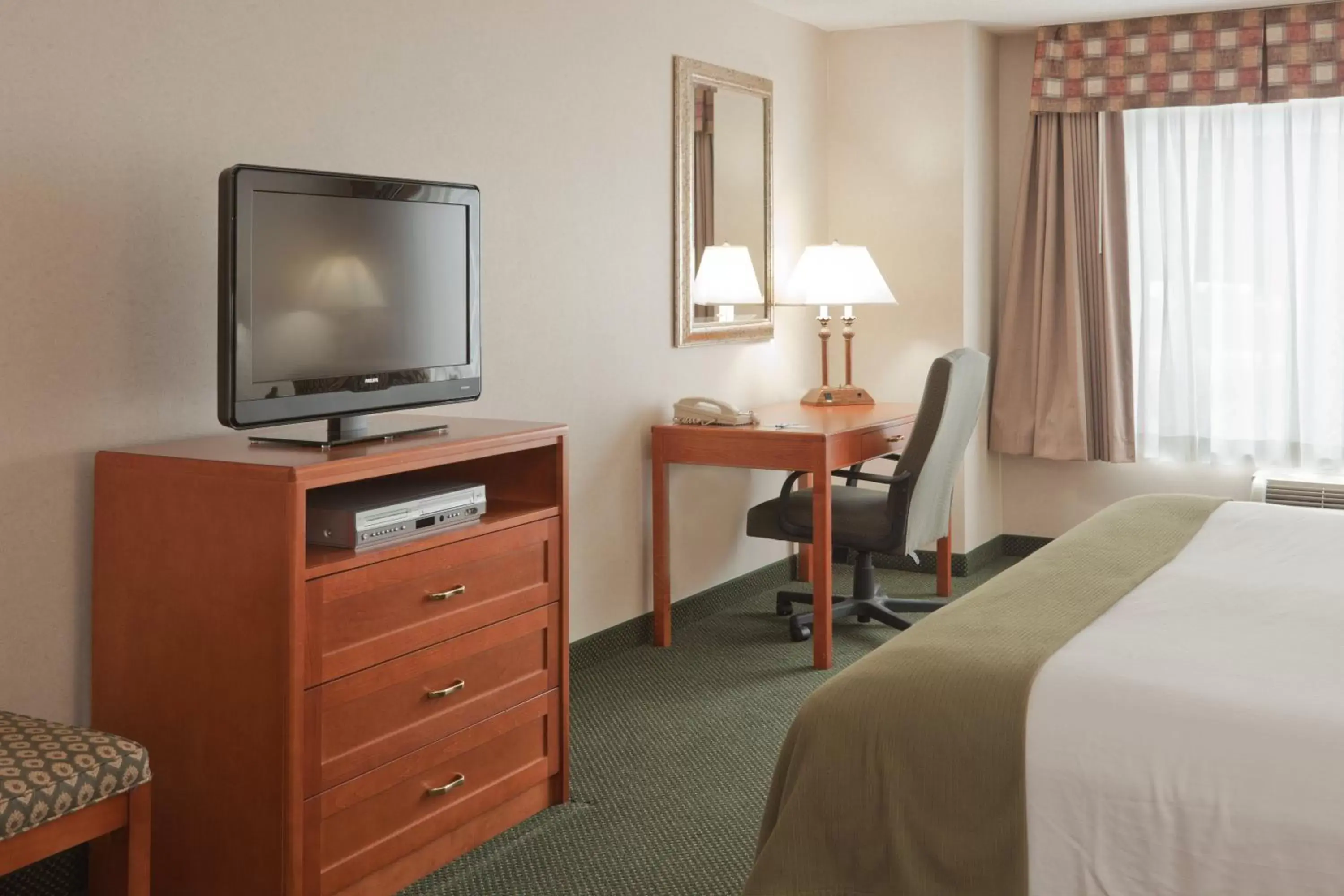 Photo of the whole room, TV/Entertainment Center in Holiday Inn Express Hotel & Suites Bryan-Montpelier, an IHG Hotel