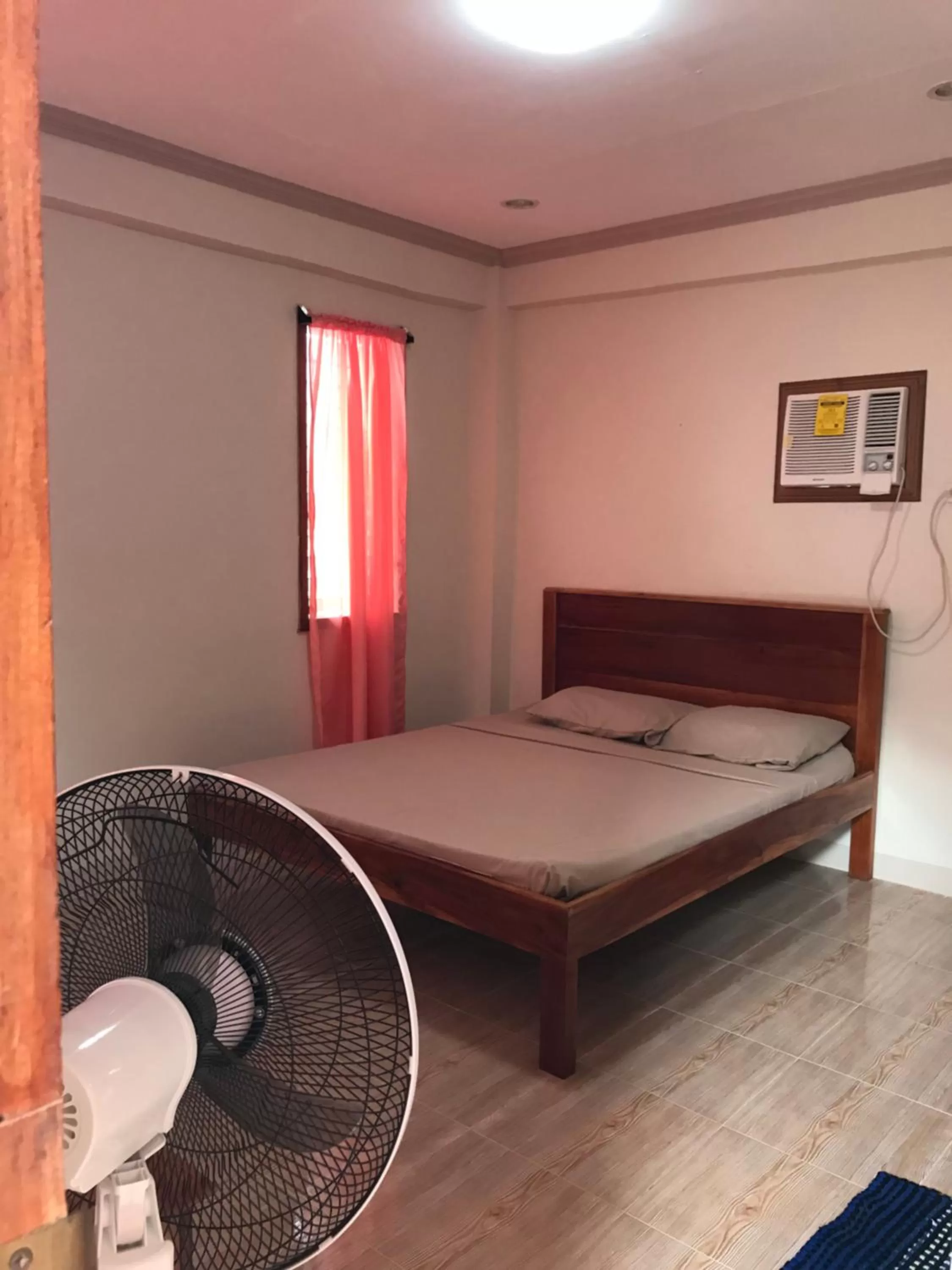 Bed in D's Oceanview Beach Resort