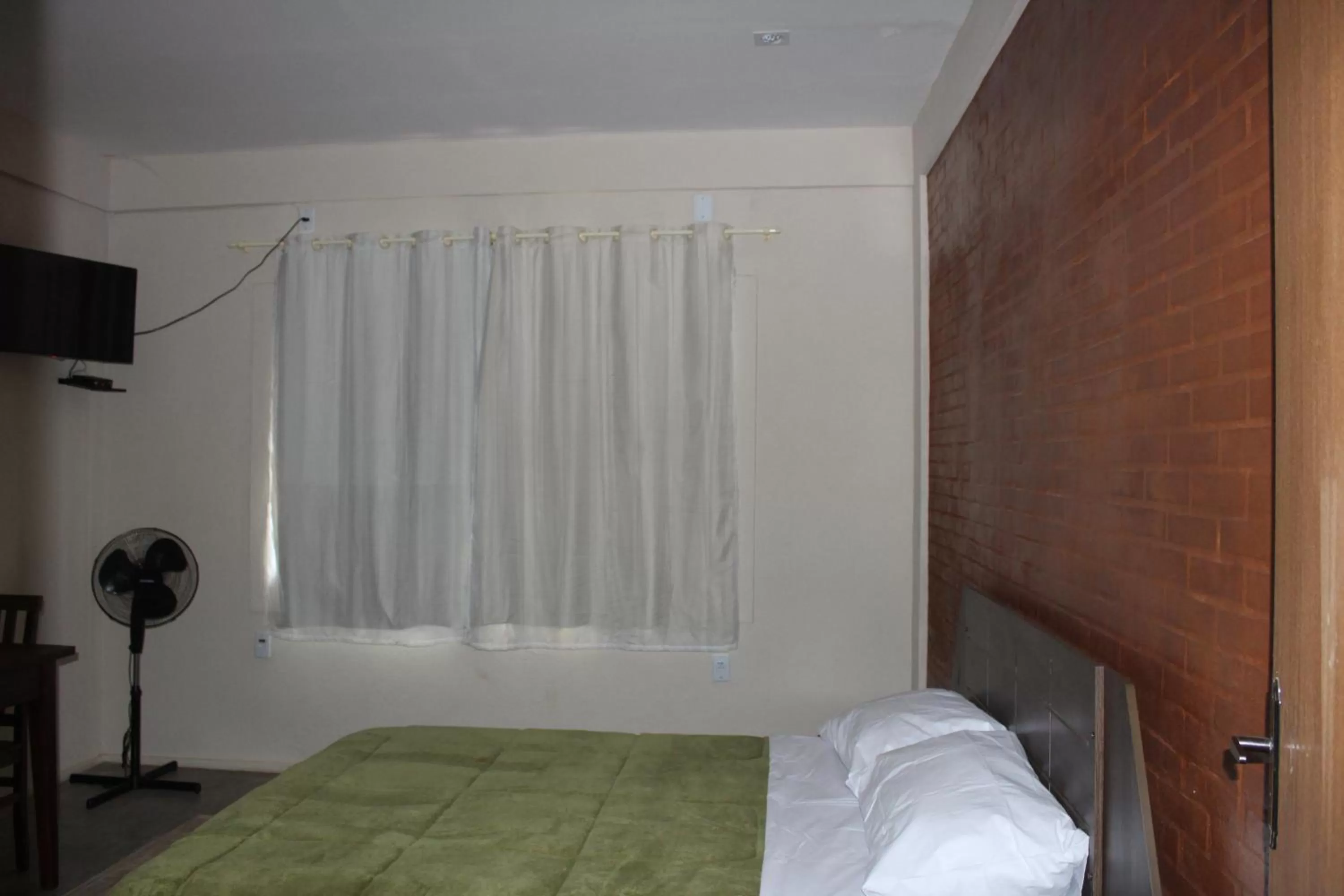 Bed in Pousada Morro dos Ventos