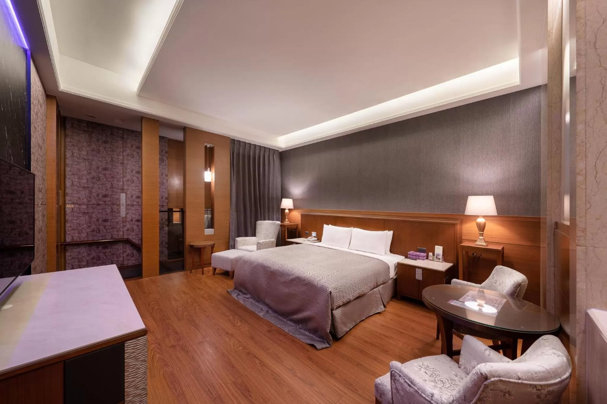 Bed in Purple Garden Motel